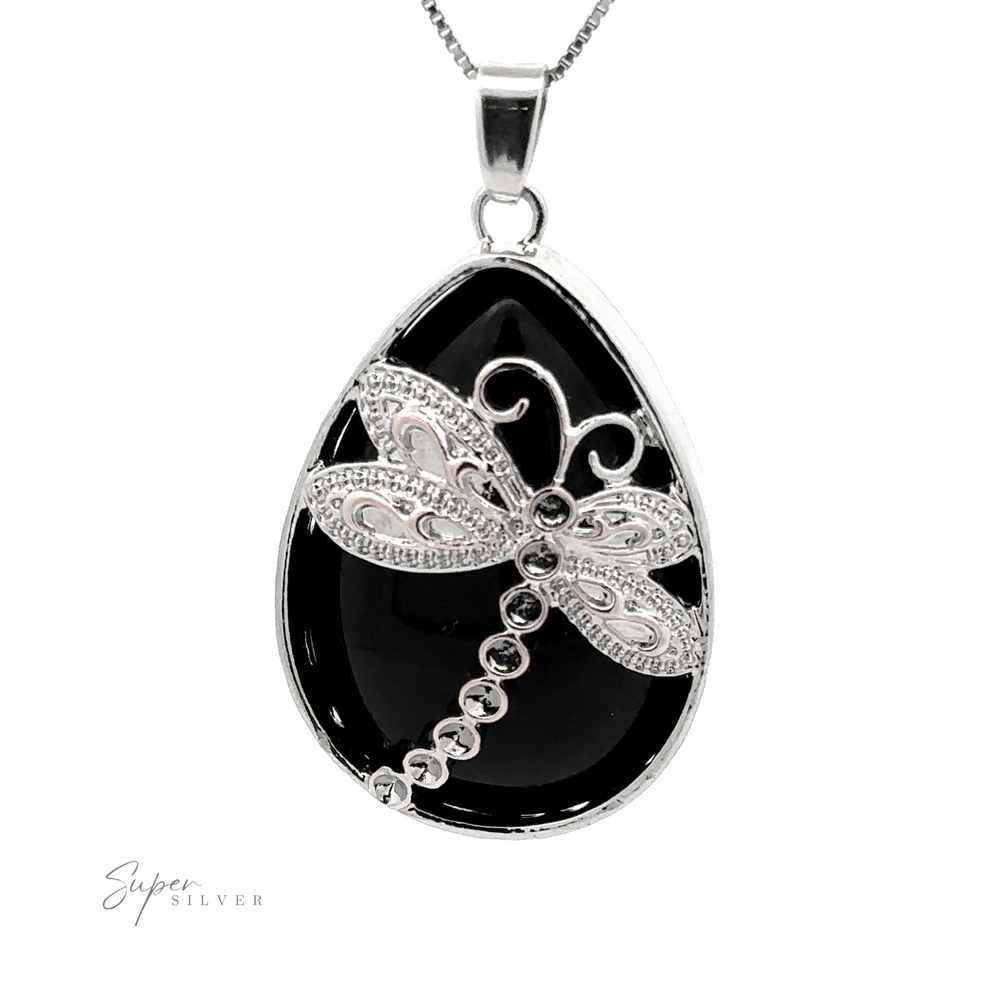 
                  
                    A Teardrop Stone pendant with Dragonfly featuring an ornate dragonfly design on a black teardrop-shaped stone background with a silver chain. Accented with hints of mixed metals, the word "Super Silver" is visible in the corner.
                  
                