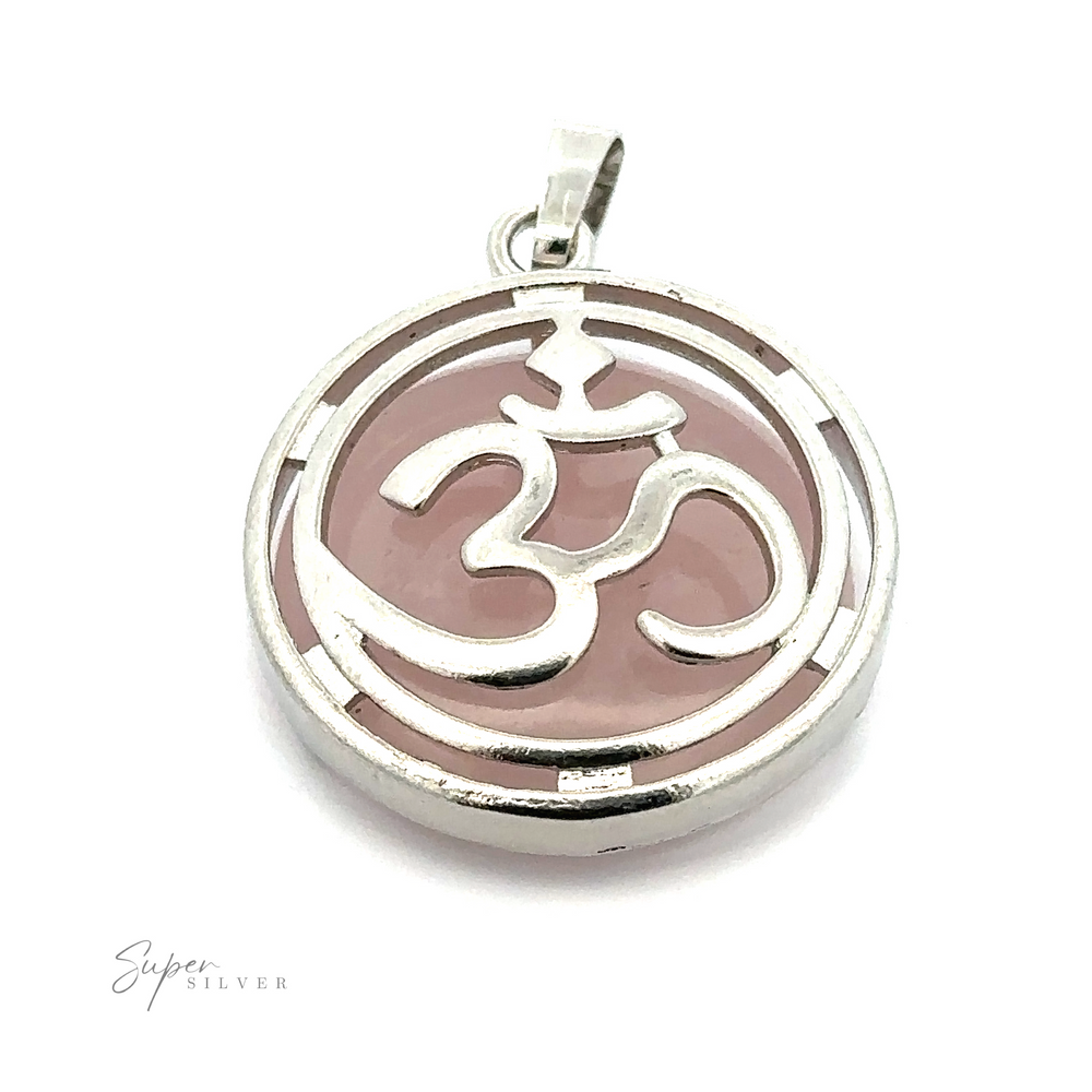
                  
                    A round silver-plated Om Pendant with a pink background, accented by mixed metals for a unique touch.
                  
                