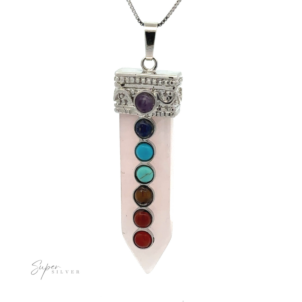 
                  
                    A silver-plated design, this Obelisk Crystal Pendant with Small Chakra Stones boasts a pointed crystal adorned with seven chakra stones in a vertical row, elegantly hanging from a chain.
                  
                