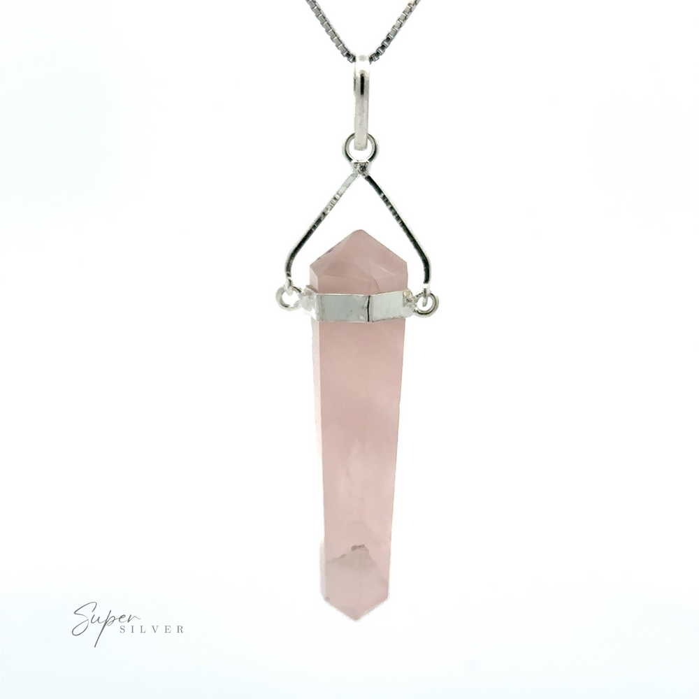 
                  
                    A Raw Stone Swivel Pendant featuring a pointed rose quartz pendant, set in a minimalist silver-plated setting with a small chain loop.
                  
                