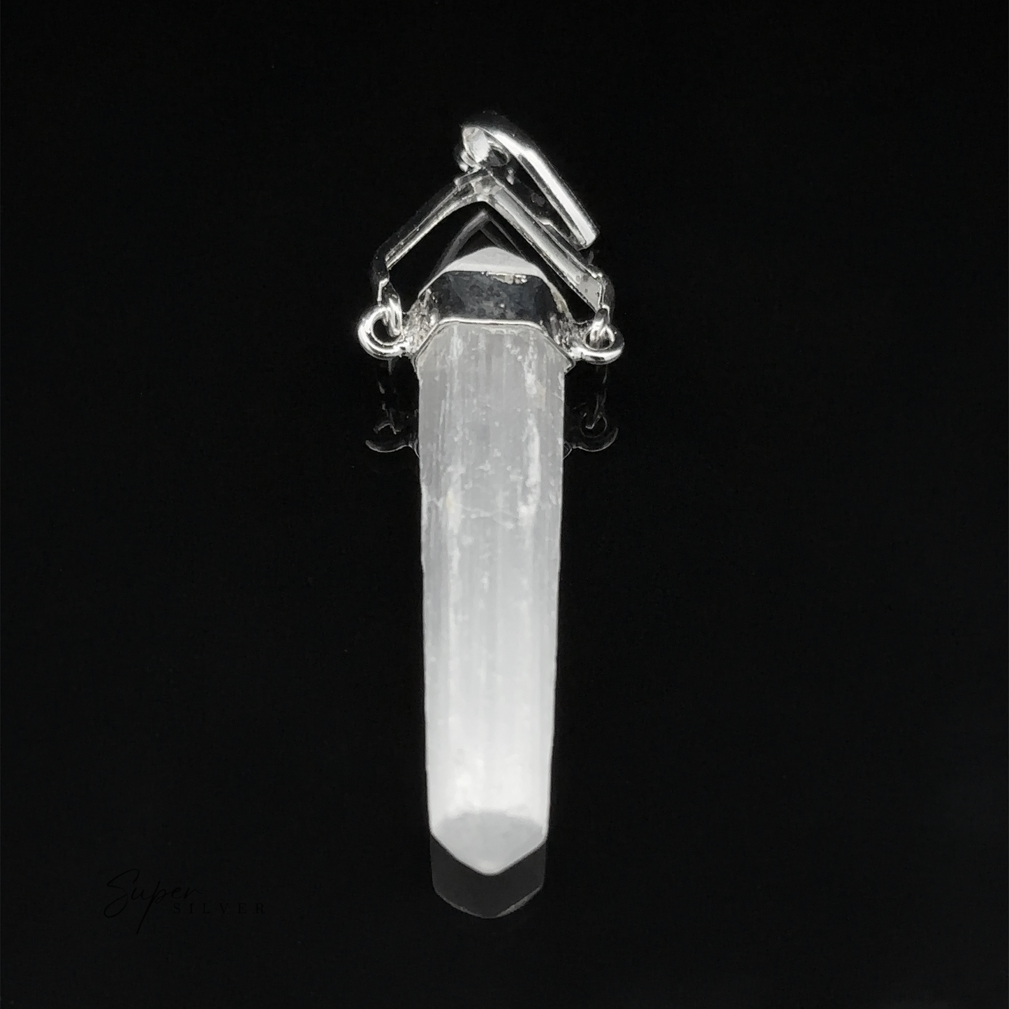 
                  
                    A Raw Stone Swivel Pendant with silver accents sits elegantly in its silver-plated setting, featuring a pointed end against a black background.
                  
                
