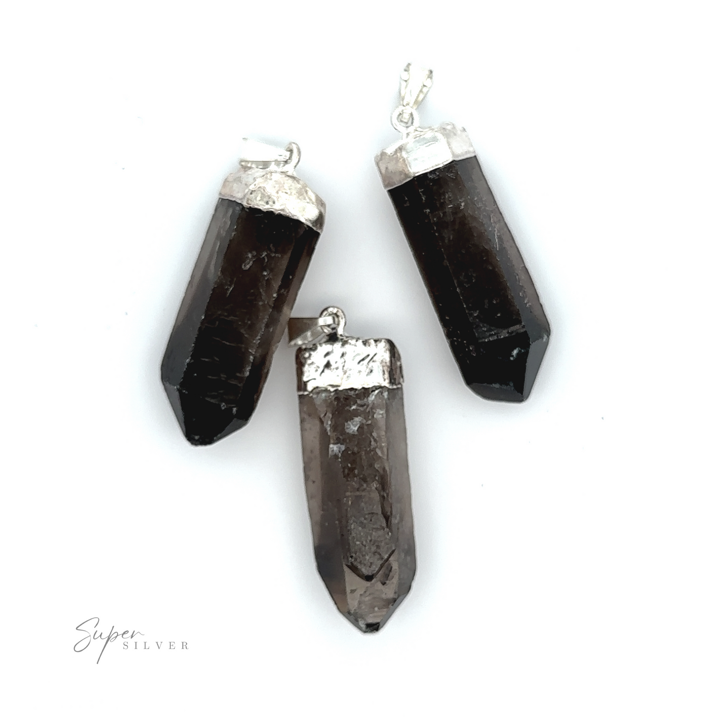 
                  
                    Three dark brown Raw Crystal Pendants With Silver Caps and loops, crafted from natural gemstone pendants, are arranged on a white background. The bottom left corner features the text "Super Silver.
                  
                
