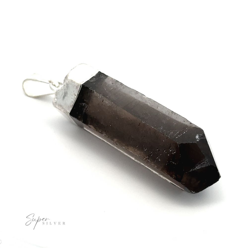 
                  
                    Close-up of a pointed, dark-colored natural gemstone pendant with a silver cap and bail, labeled "Raw Crystal Pendant With Silver Cap" on a white background.
                  
                
