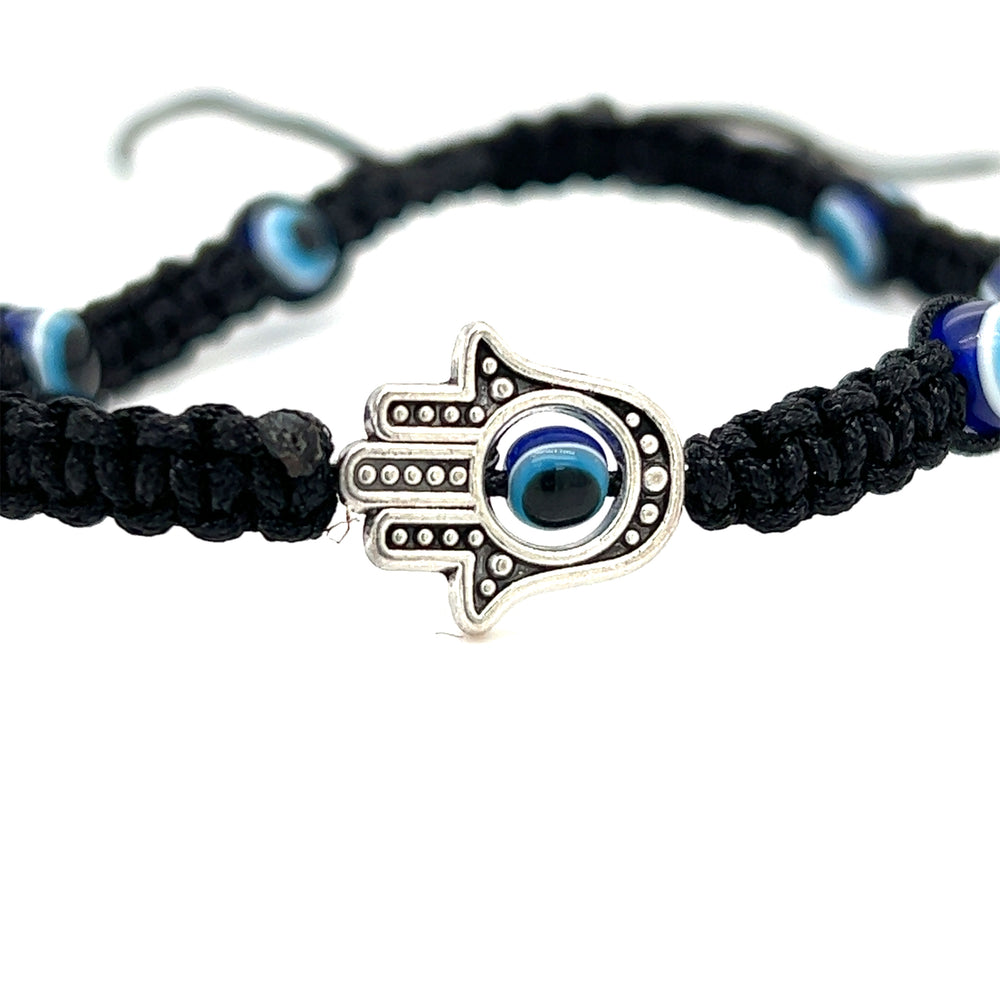
                  
                    This boho vibe Adjustable Evil Eye Bracelet by Super Silver features a black design with an evil eye.
                  
                