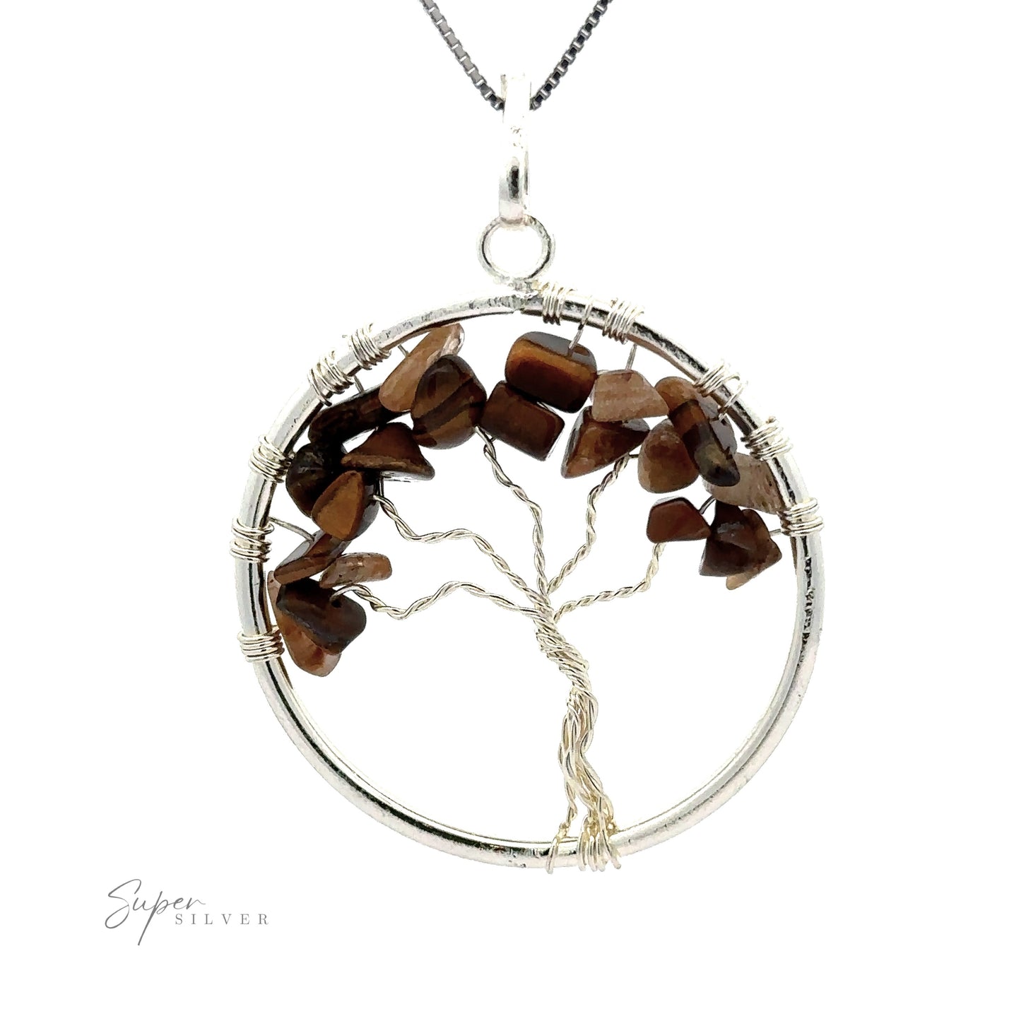 
                  
                    A stunning Wire Wrapped Tree of Life Pendant with Stones featuring a silver wire-wrapped tree with polished brown gemstone chips for leaves, encircled by a silver ring. The background is white.
                  
                