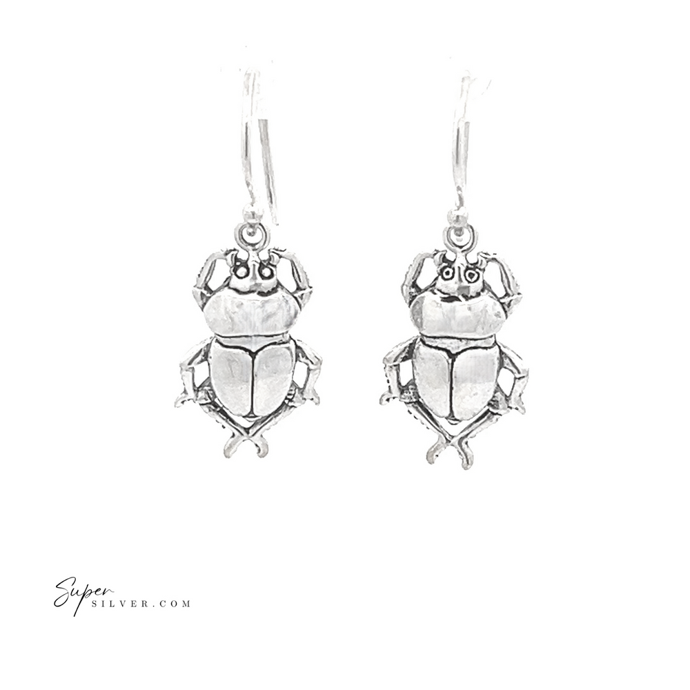 
                  
                    Set against a white background, the Beetle Earrings are a pair of sterling silver scarab beetles featuring detailed engravings that evoke the allure of ancient Egyptian jewelry.
                  
                