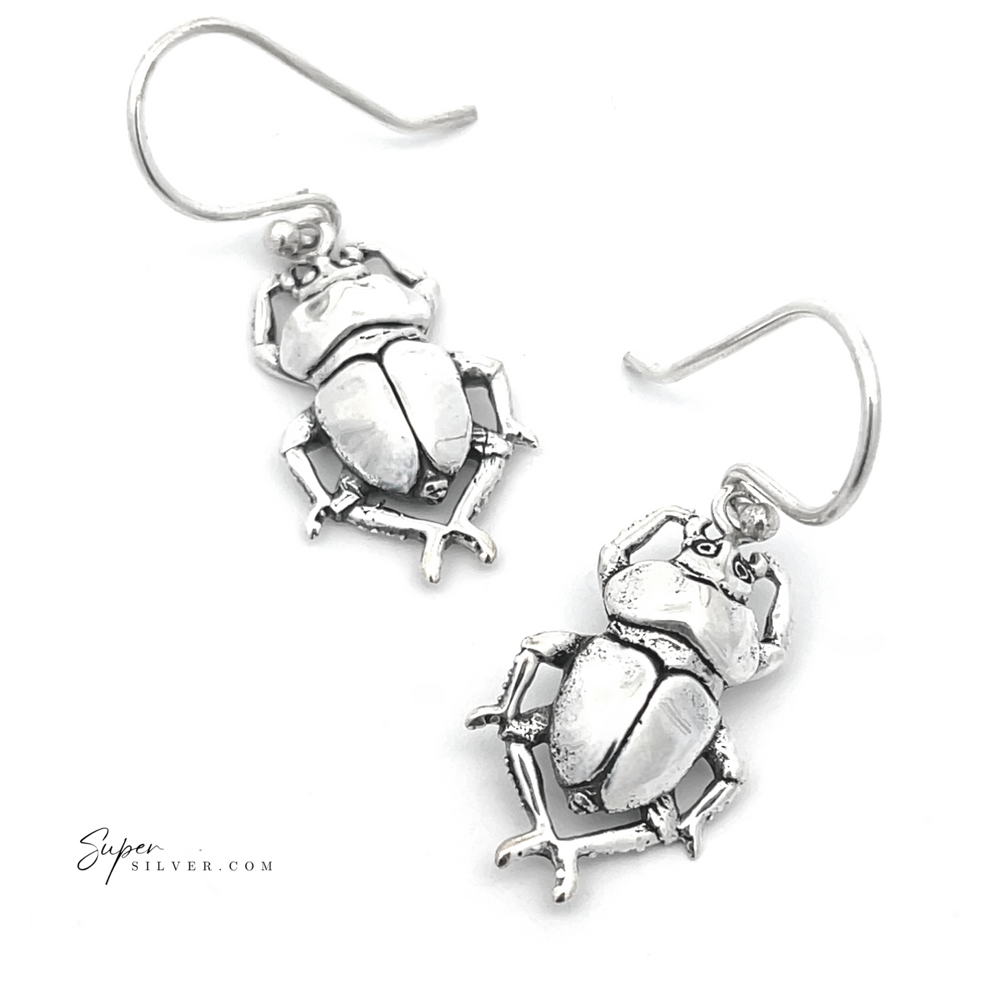 
                  
                    Introducing our Beetle Earrings: These sterling silver accessories capture the essence of ancient Egyptian jewelry with their stunning scarab beetle design, set against a white backdrop for a timeless allure.
                  
                