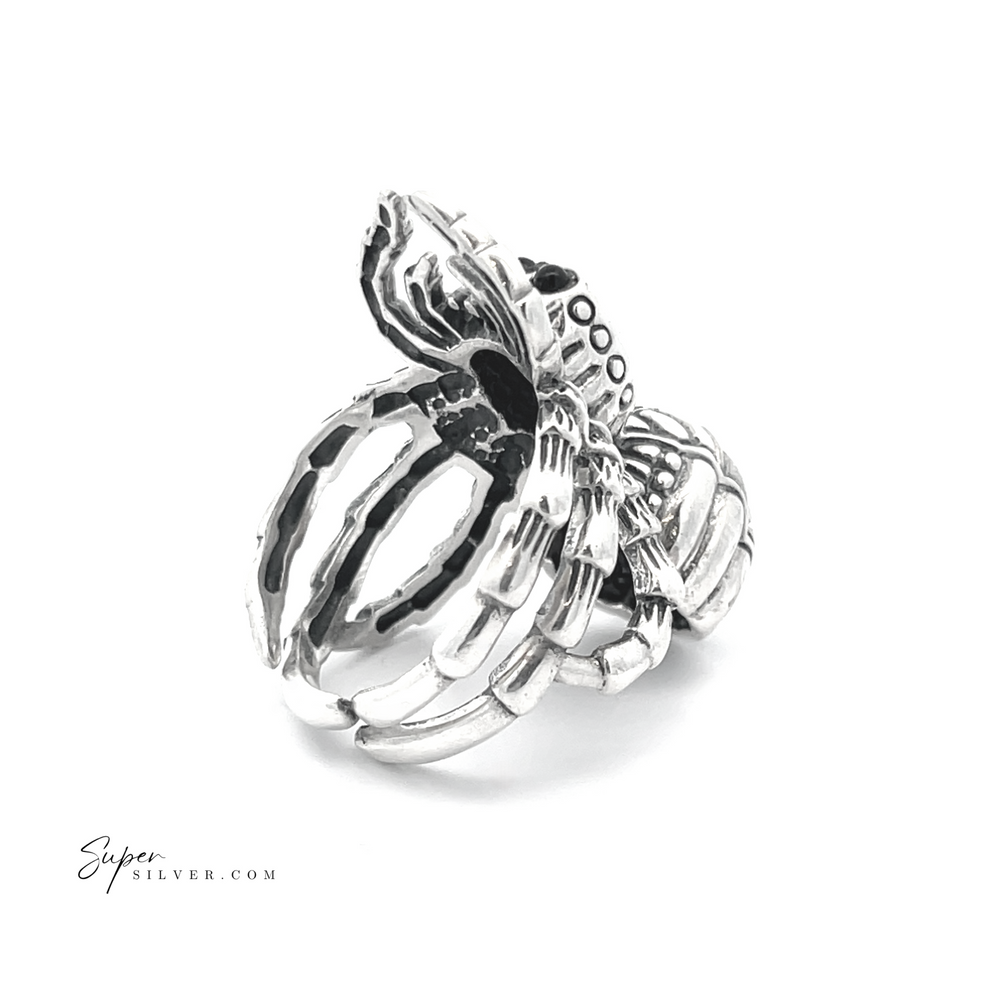 
                  
                    This adjustable statement spider ring, crafted from sterling silver and featuring intricate detailing on a white background, epitomizes unique and artistic handcrafted jewelry.
                  
                