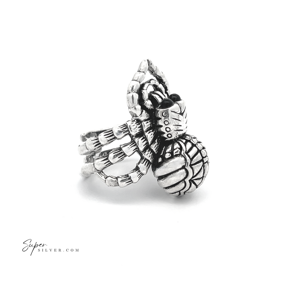 
                  
                    Adjustable Statement Spider Ring crafted in sterling silver features intricately detailed, textured legs and body, set against a white background to highlight the artistry of handcrafted jewelry.
                  
                