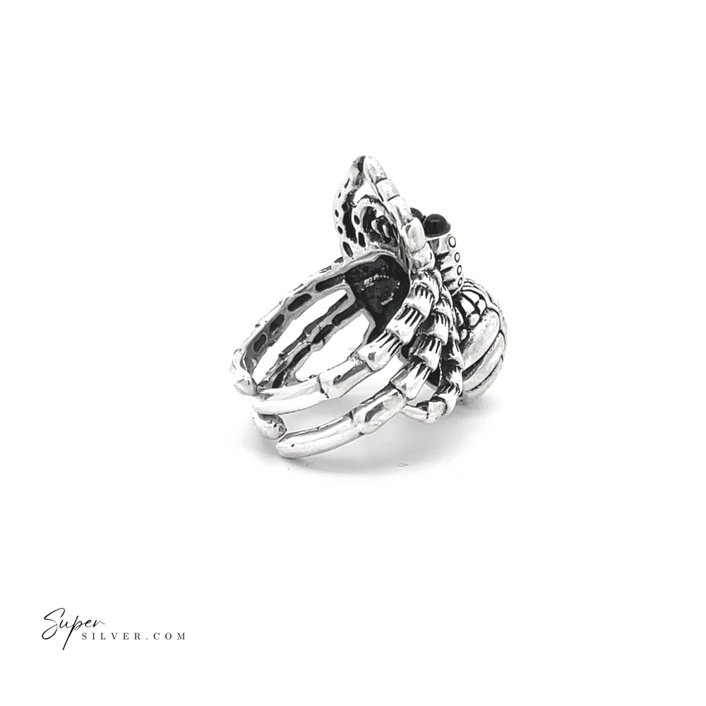 
                  
                    The Adjustable Statement Spider Ring features a detailed design with intricate textures and patterns, conveying elegance and craftsmanship through its handcrafted sterling silver construction.
                  
                