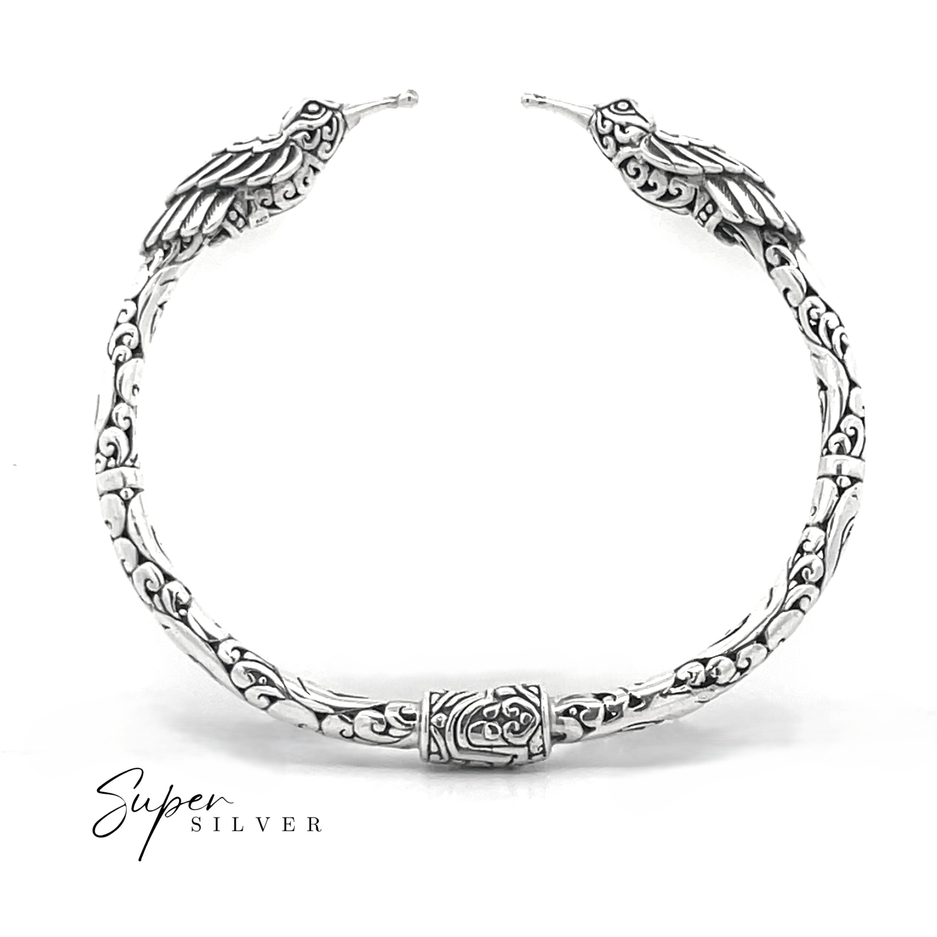 The Enchanting Hummingbird Hinge Bracelet features intricate engraved patterns and hummingbird-shaped ends, shown on a white background with "Super Silver" text in the corner.