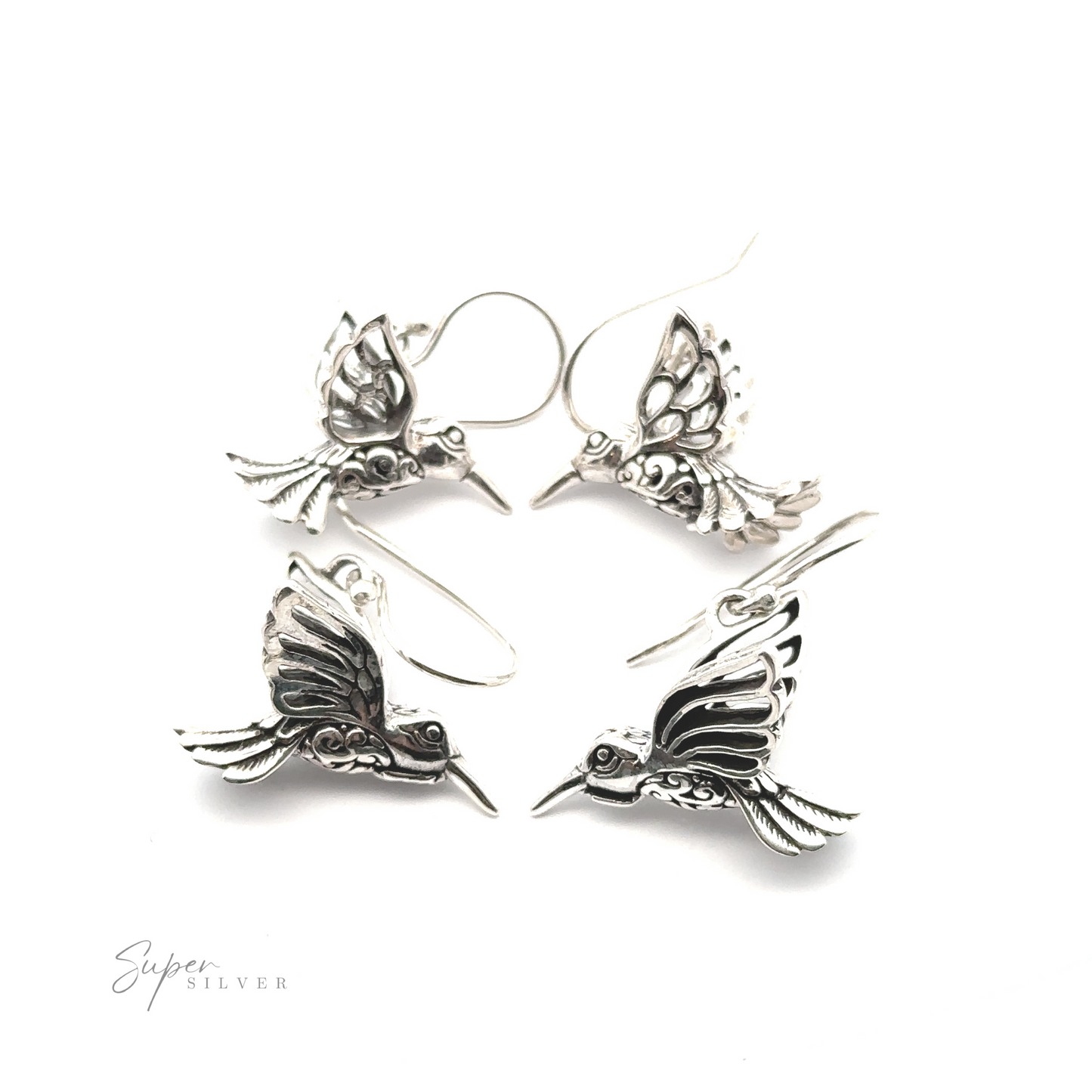 Four Filigree Hummingbird Earrings, adorned with delicate filigree details, are arranged in a circular pattern on a white background.