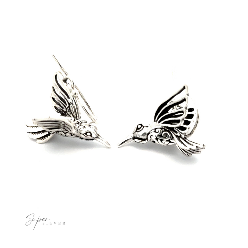 
                  
                    Filigree Hummingbird Earrings with intricate filigree engravings, displayed on a plain white background.
                  
                