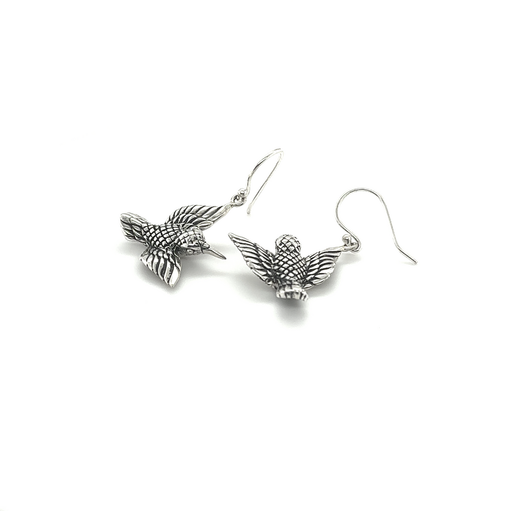 
                  
                    A pair of Super Silver Detailed Hummingbird Earrings adorned with delicate hummingbirds.
                  
                