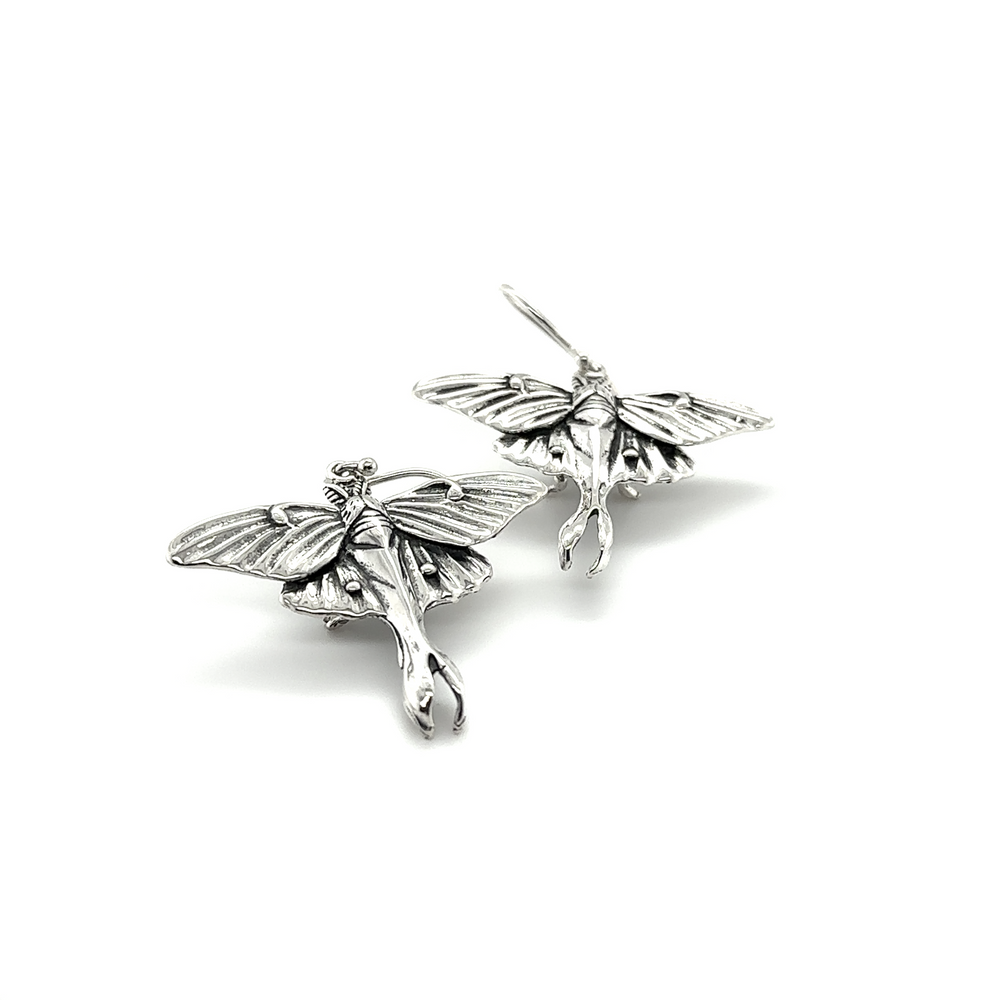 Enchanting Super Silver Statement Lunar Moth Earrings on a white background.