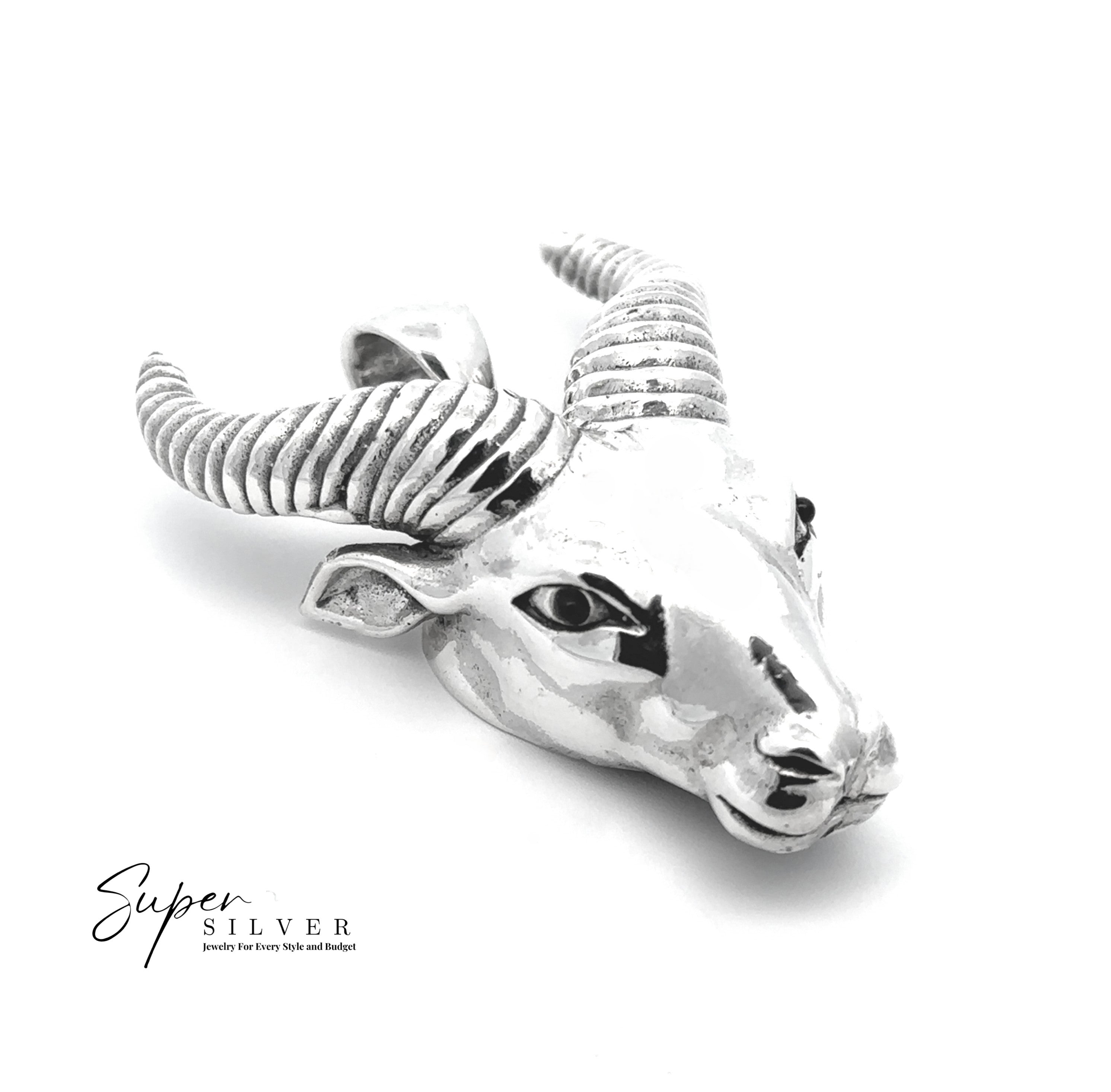 The Ram Statement Pendant, crafted in sterling silver with curved, textured horns, is shown against a white background. "Super Silver" branding appears in the lower left corner—ideal for gothic jewelry enthusiasts.