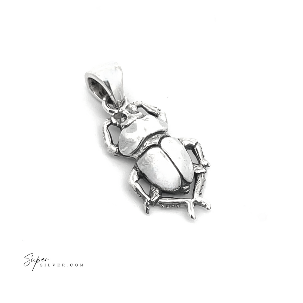 The Little Beetle Pendant is a handcrafted sterling silver piece highlighting intricate legs and wings, capturing the elegance of ancient Egyptian jewelry against a plain white background.