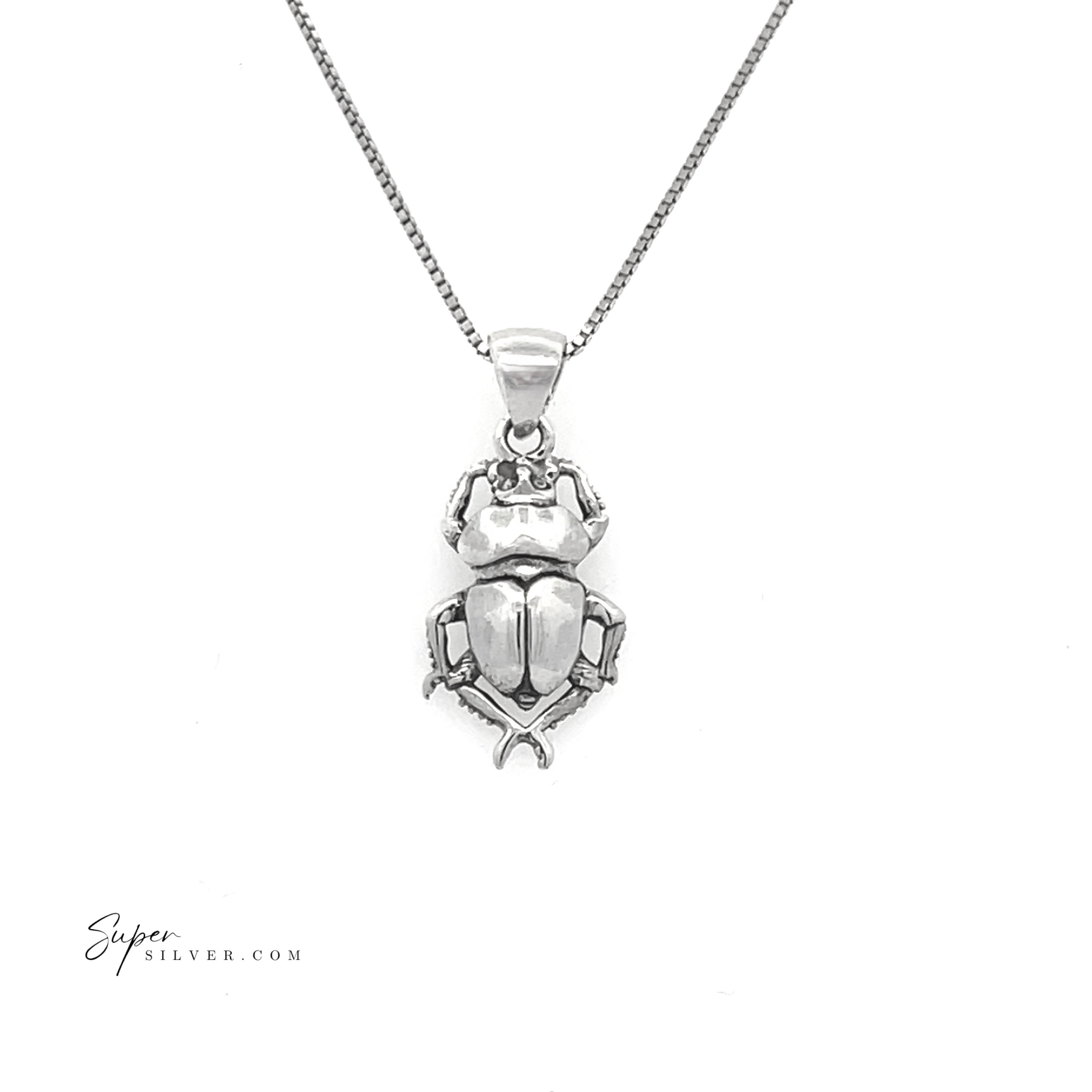 A handcrafted sterling silver "Little Beetle Pendant" necklace, inspired by ancient Egyptian jewelry, is showcased against a simple white background.