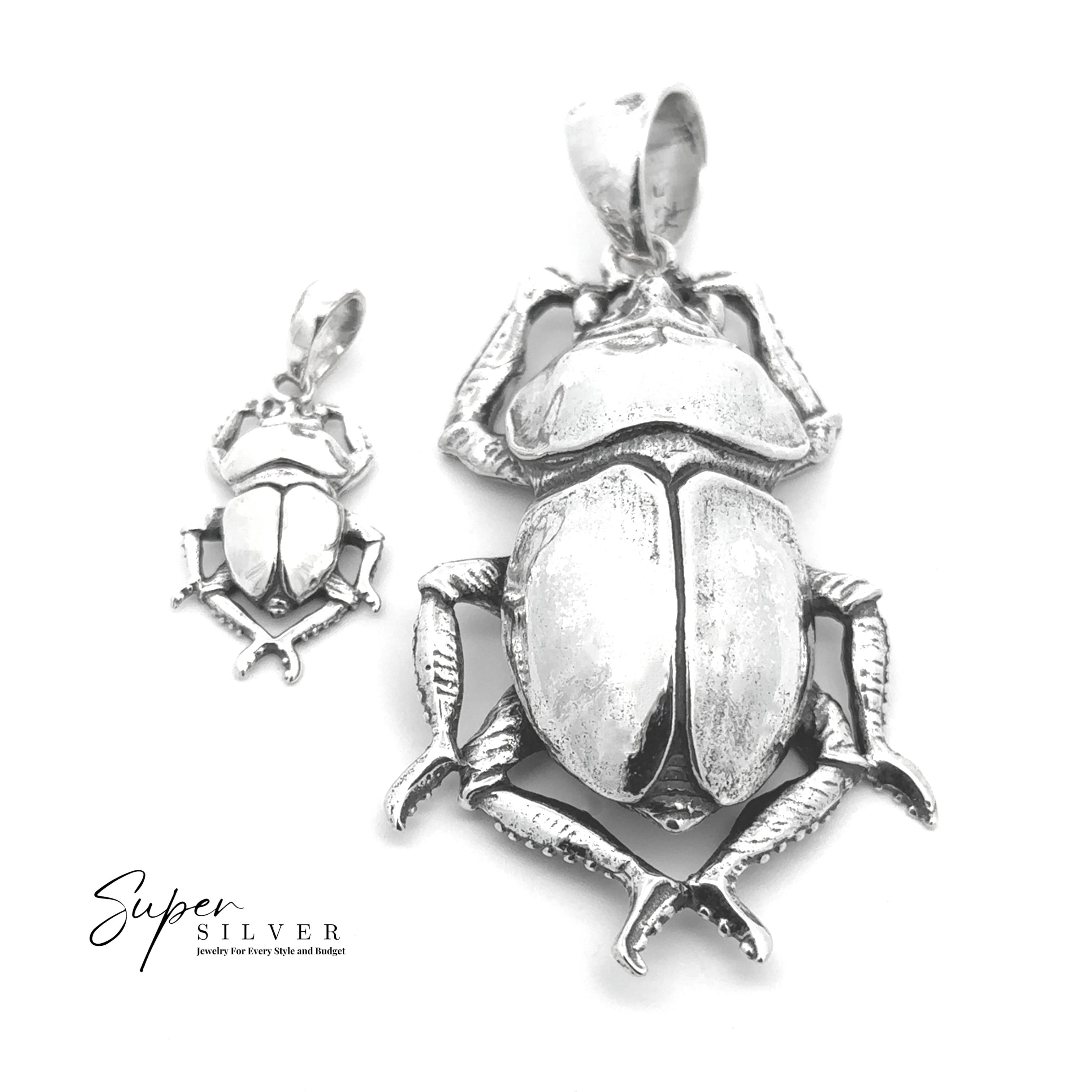 Two Beetle Pendant necklaces in different sizes are displayed on a white background with the "Super Silver" logo, inspired by classic Egyptian jewelry.