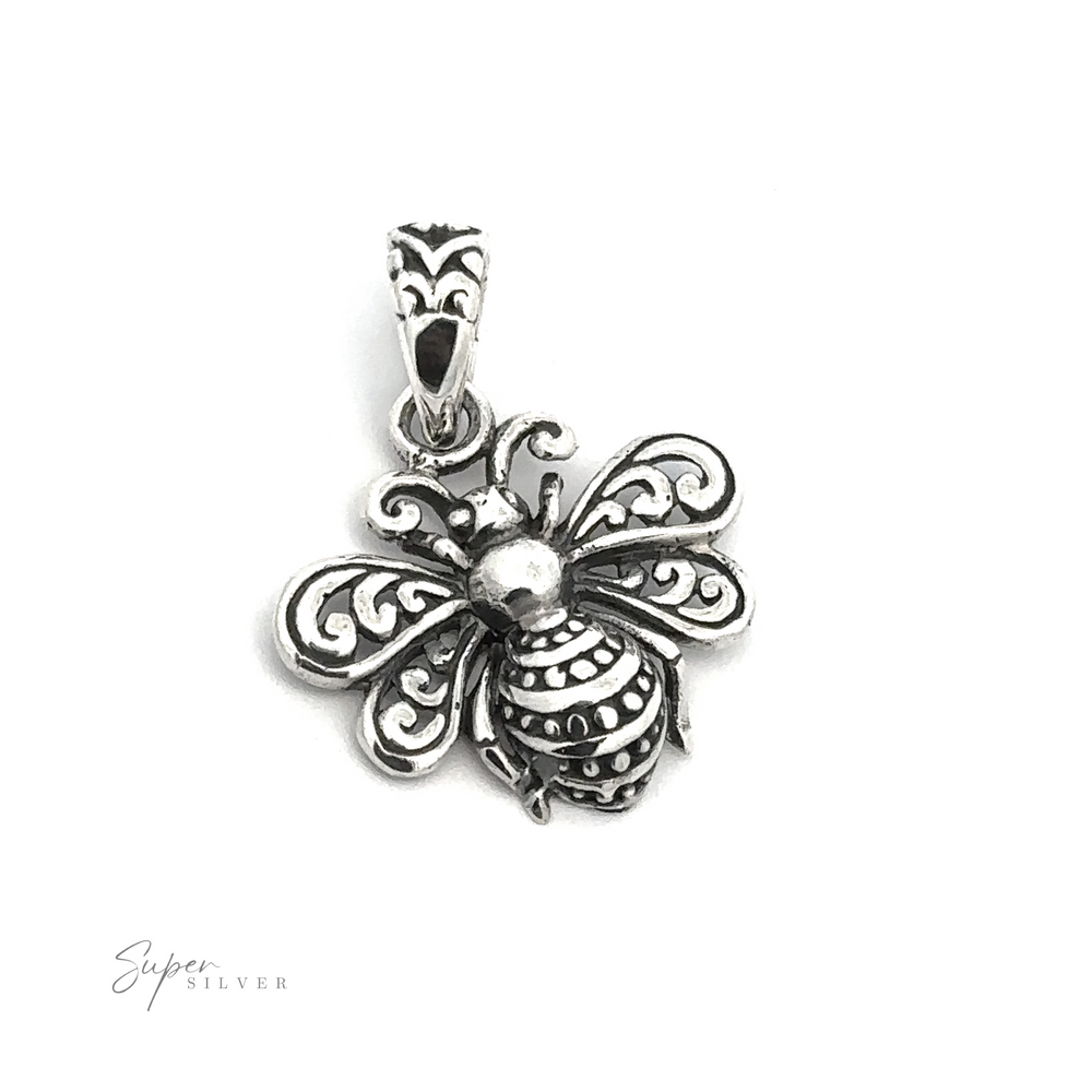 
                  
                    The Filigree Bee Pendant, crafted from .925 Sterling Silver, showcases intricate detailing on its wings and body. A stunning piece of artisan jewelry, it is beautifully displayed against a plain white background.
                  
                