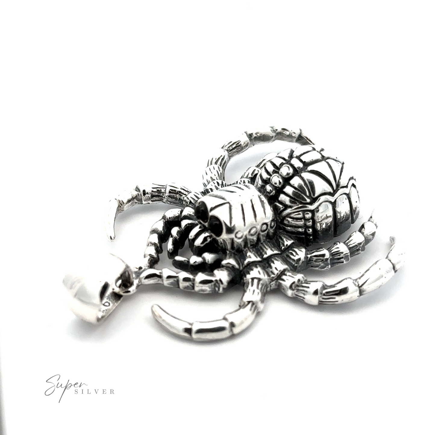 A silver, handcrafted Large Spider Pendant with detailed designs on its body and legs, displayed on a white background. Made from .925 Sterling Silver, it has the text "Super Silver" in the lower-left corner.