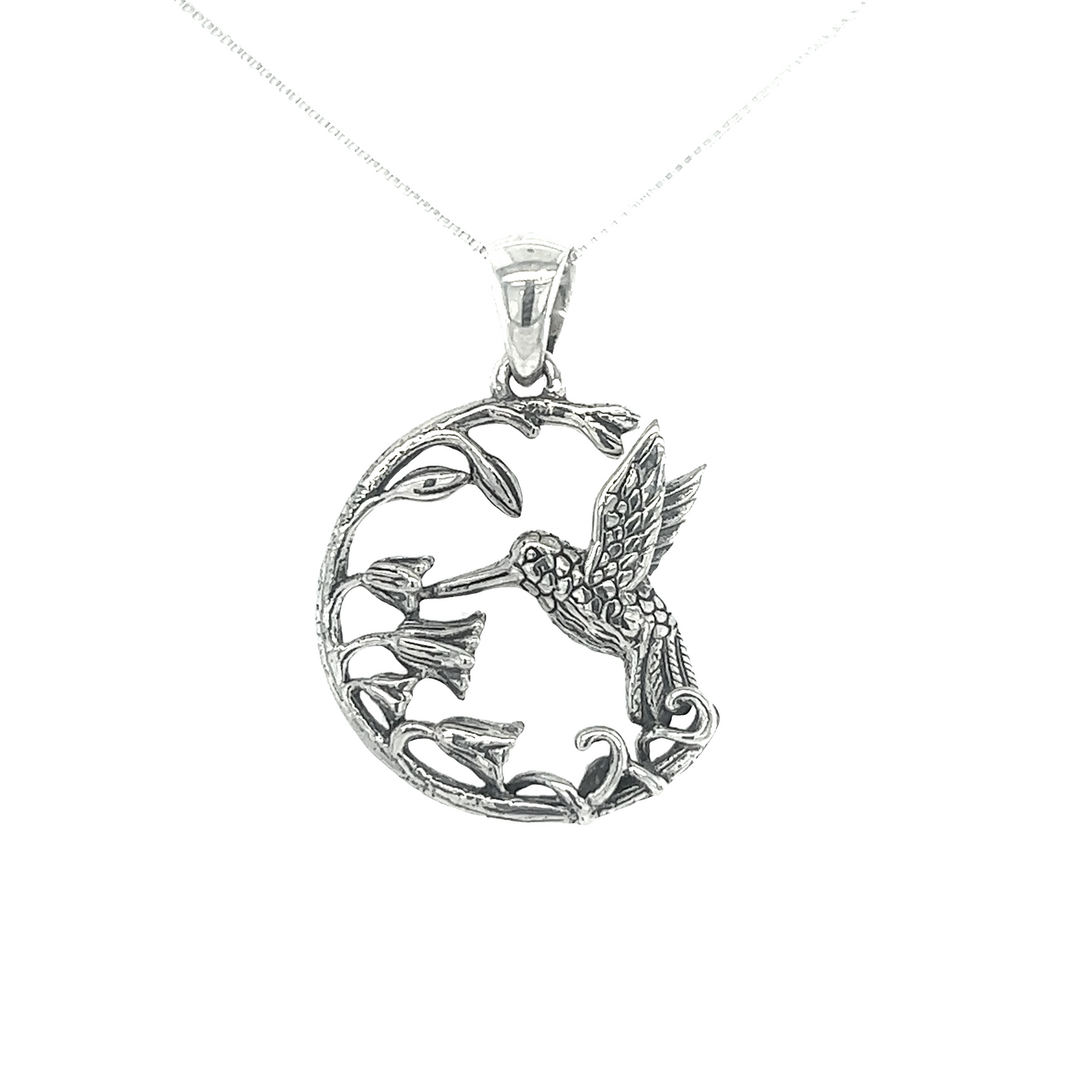 A Super Silver Floral Hummingbird Pendant, crafted with .925 sterling silver, showcases nature's sweetest secret.