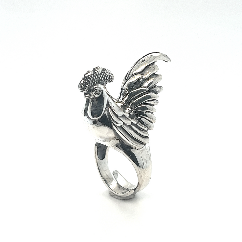 
                  
                    An Exceptional Rooster Ring with intricate silver work on a white background.
                  
                