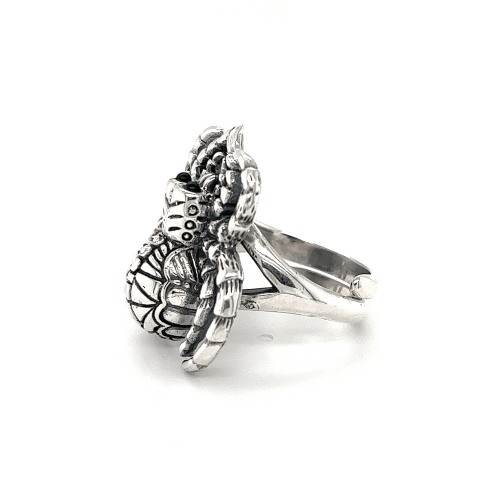 
                  
                    An adjustable silver Statement Spider Ring with a flower on it, made of .925 Sterling Silver.
                  
                