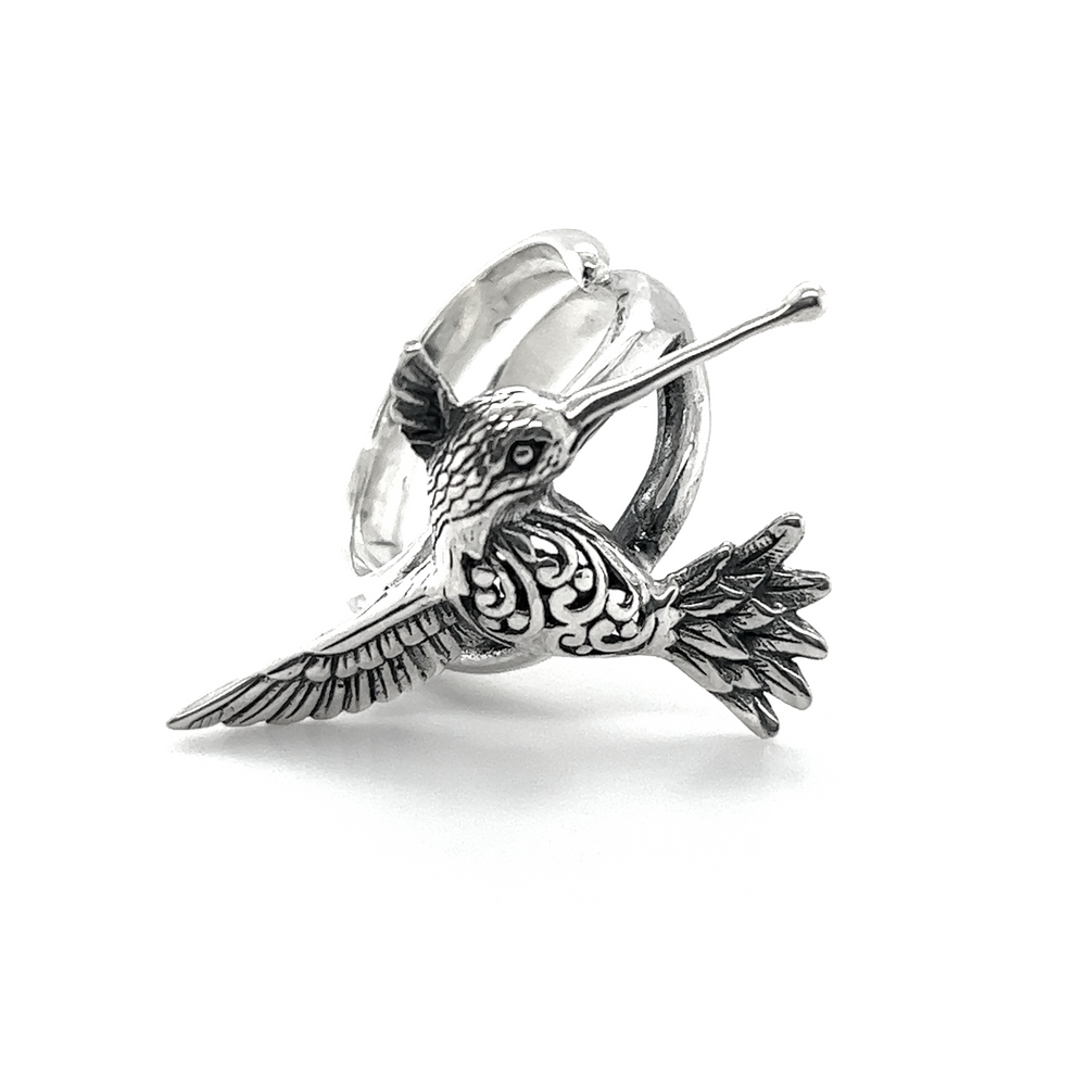 
                  
                    An adjustable silver Filigree Hummingbird Ring with filigree design on a white background.
                  
                