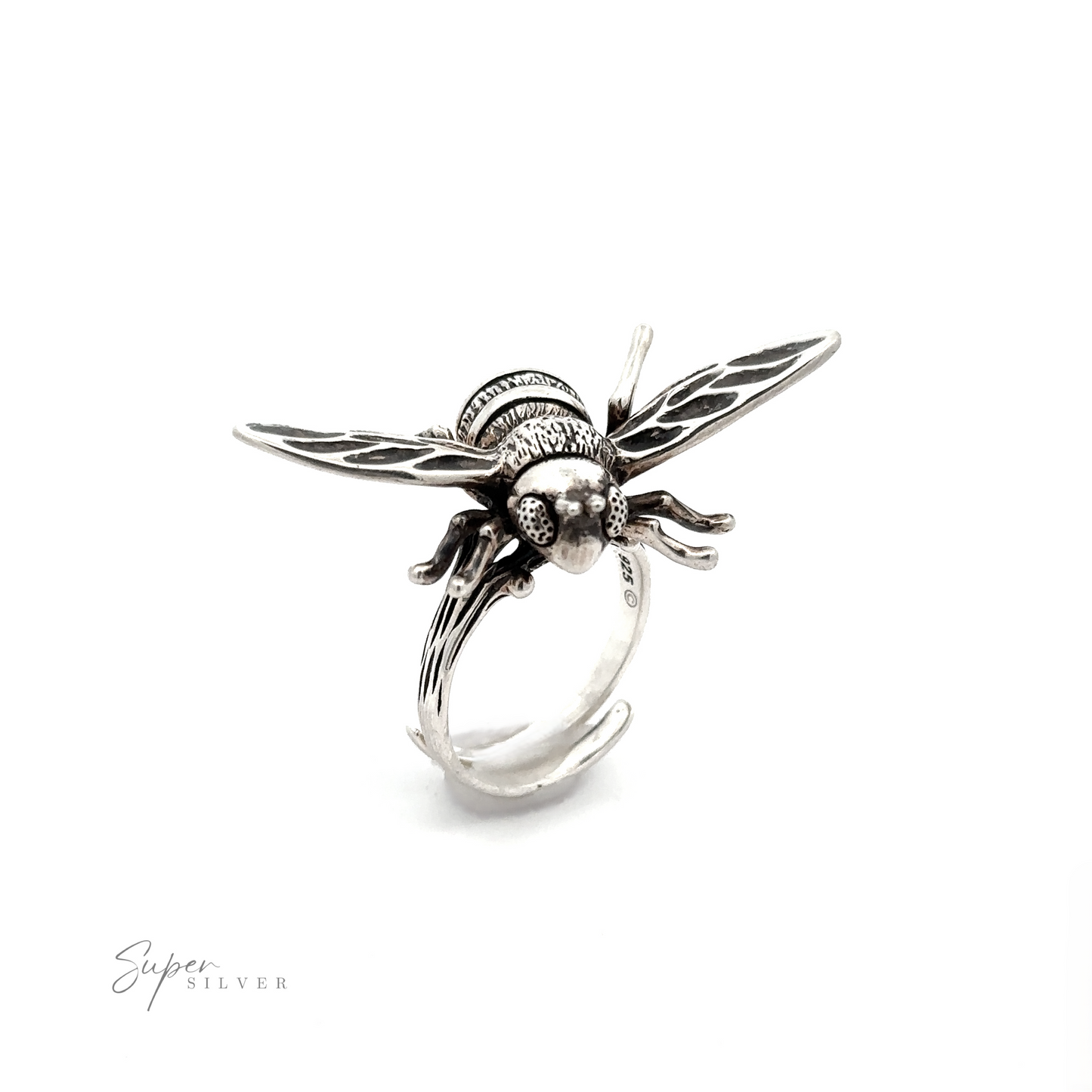 
                  
                    A Large Bee Ring made from .925 silver features a detailed, three-dimensional bee design with outspread wings on a white background. The name "Super Silver" appears in small text at the bottom left.
                  
                