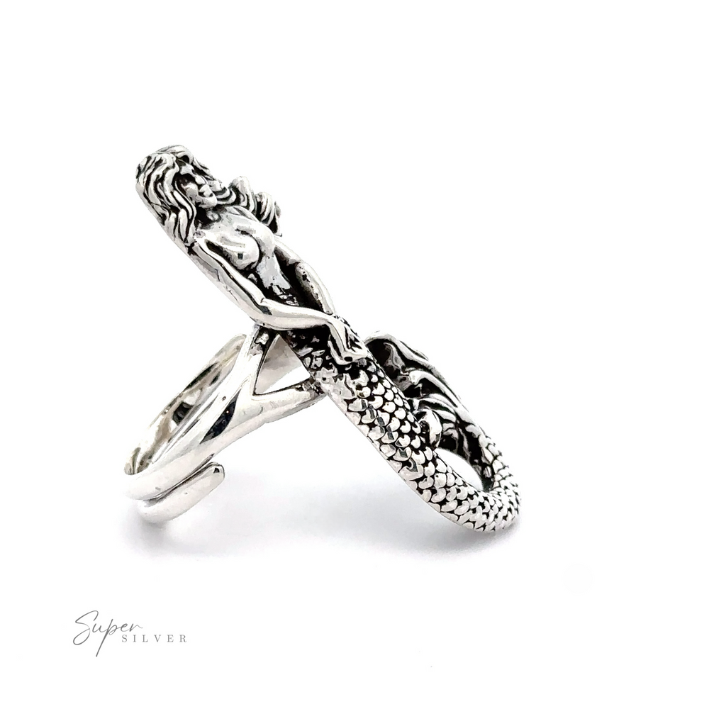 
                  
                    Statement Adjustable Mermaid Ring featuring a Large Mermaid design with detailed scales and flowing hair, showcased against a white background with a signature "super silver.
                  
                
