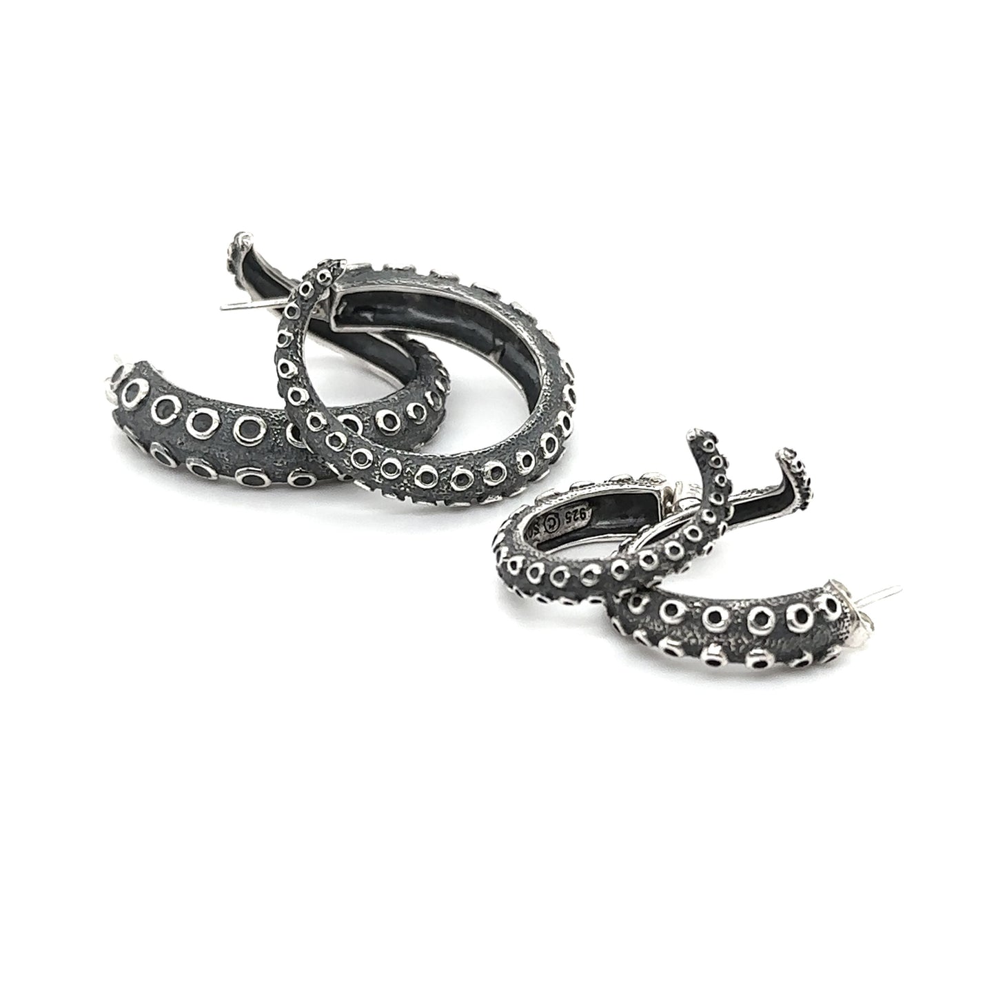 A pair of Super Silver Edgy Octopus Tentacle Hoop Earrings on a white background.