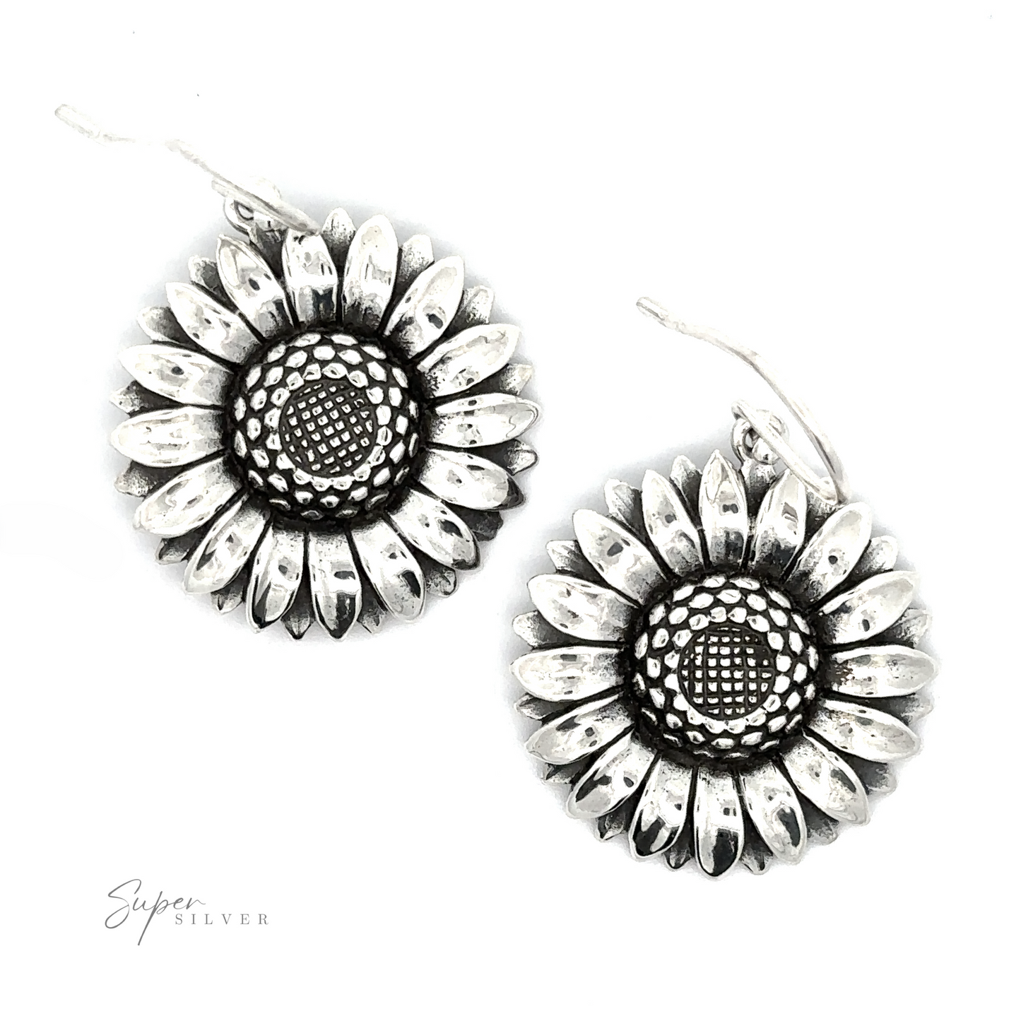 A pair of Silver Sunflower Earrings with detailed petal designs and textured centers, isolated on a white background.