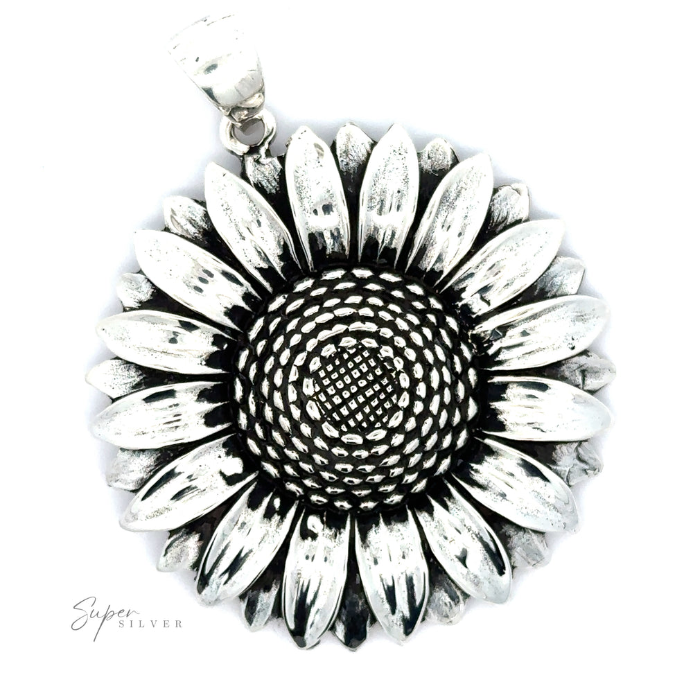 
                  
                    Silver Sunflower Pendant shaped like a sunflower with detailed petal textures and an oxidized finish, isolated on a white background with a signature.
                  
                