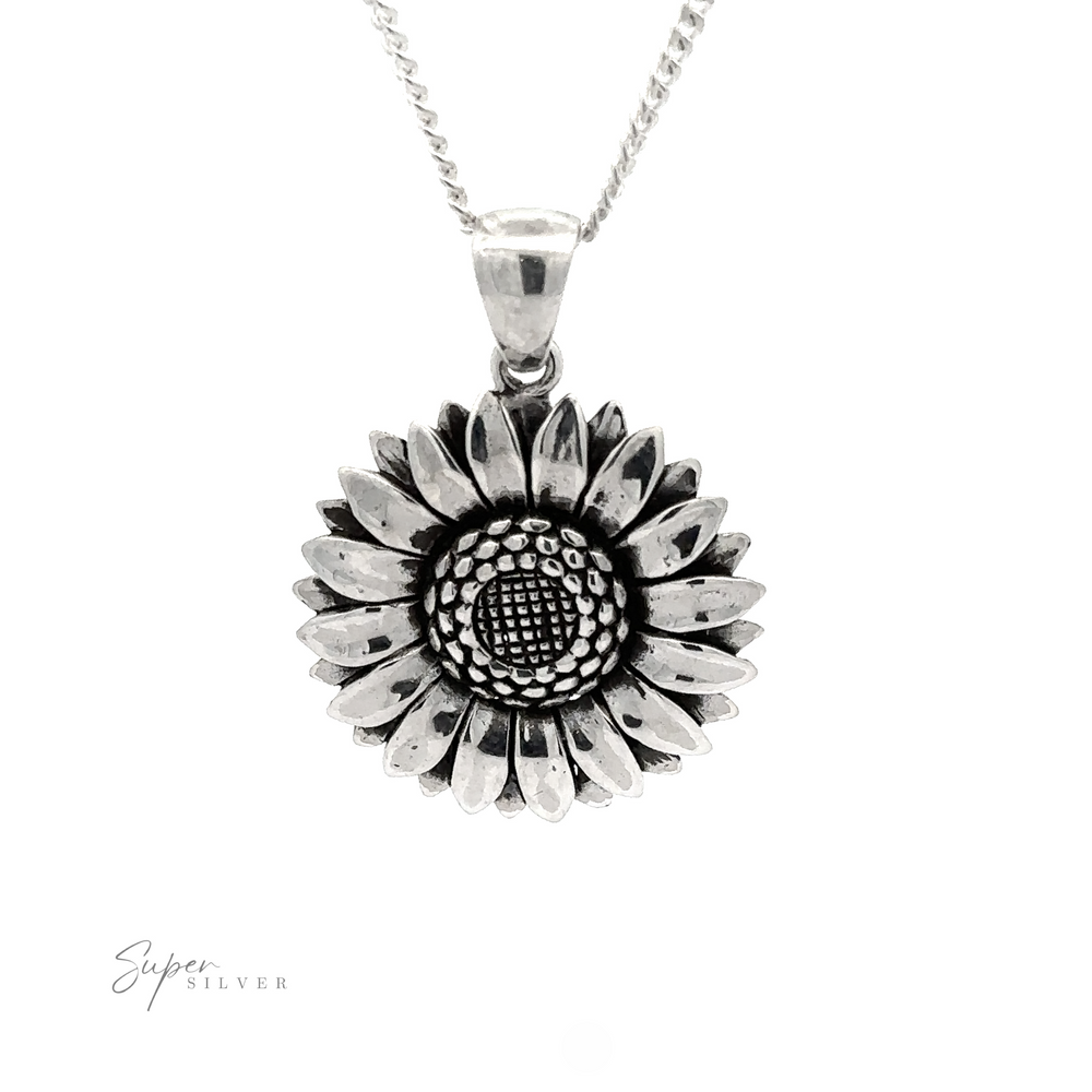 
                  
                    Silver Sunflower Pendants on a chain, featuring detailed petals and an oxidized finish center, displayed against a white background.
                  
                