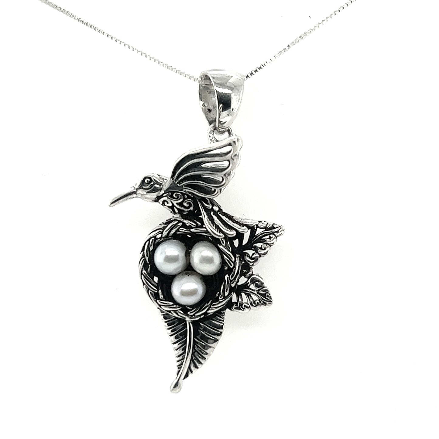 
                  
                    A Super Silver Hummingbird Pendant with Nest of Pearls on a silver chain.
                  
                