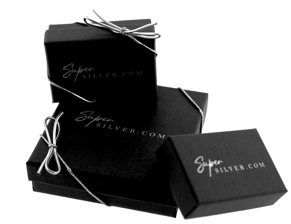 Three black Gift Wrap tied with silver ribbons, each with the inscription 