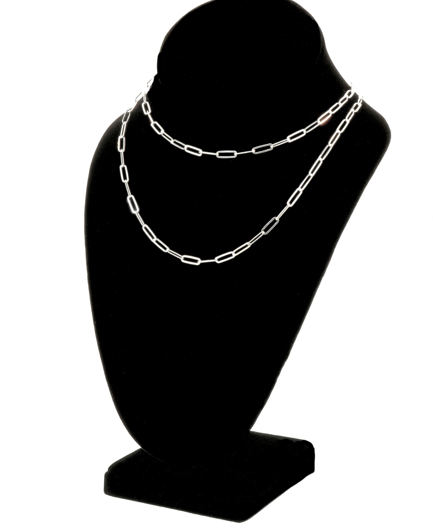 
                  
                    A Sterling Silver Paperclip Chain, embodying contemporary elegance, is beautifully displayed on a black jewelry bust stand. This exquisite piece showcases exceptional Italian craftsmanship, making it a timeless addition to any collection.
                  
                