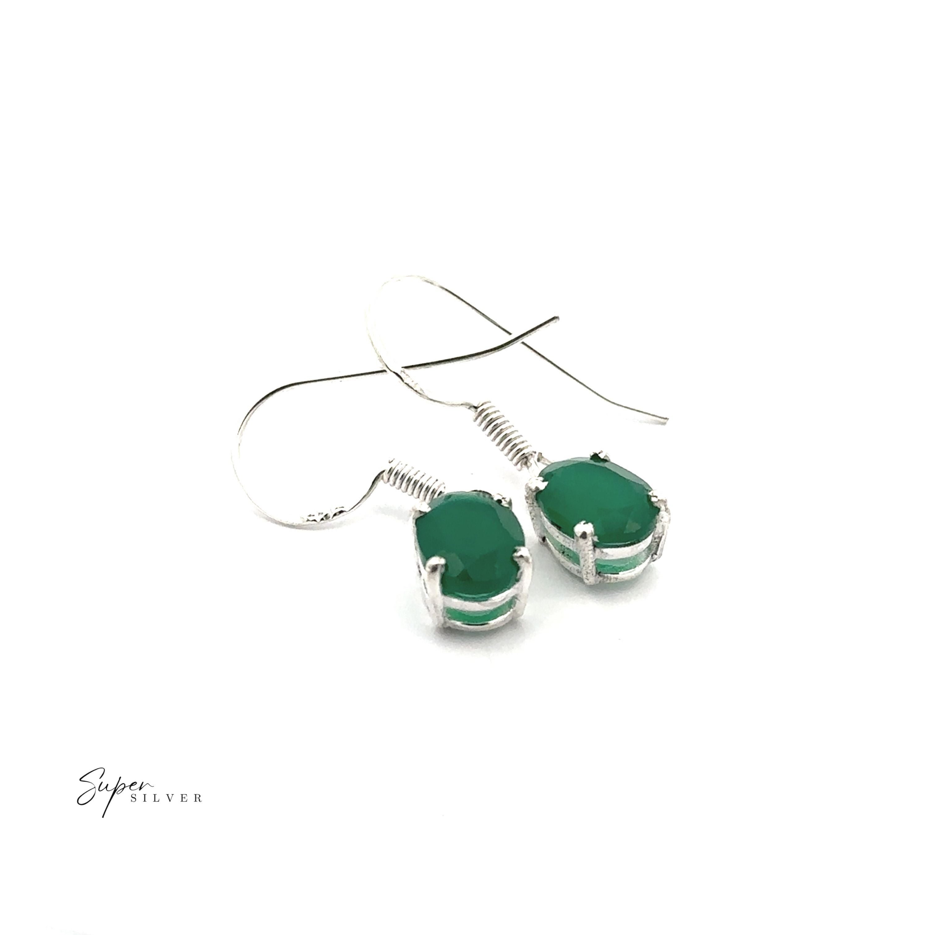 Brilliant Oval Gemstone Earrings featuring prong-set green gemstones.