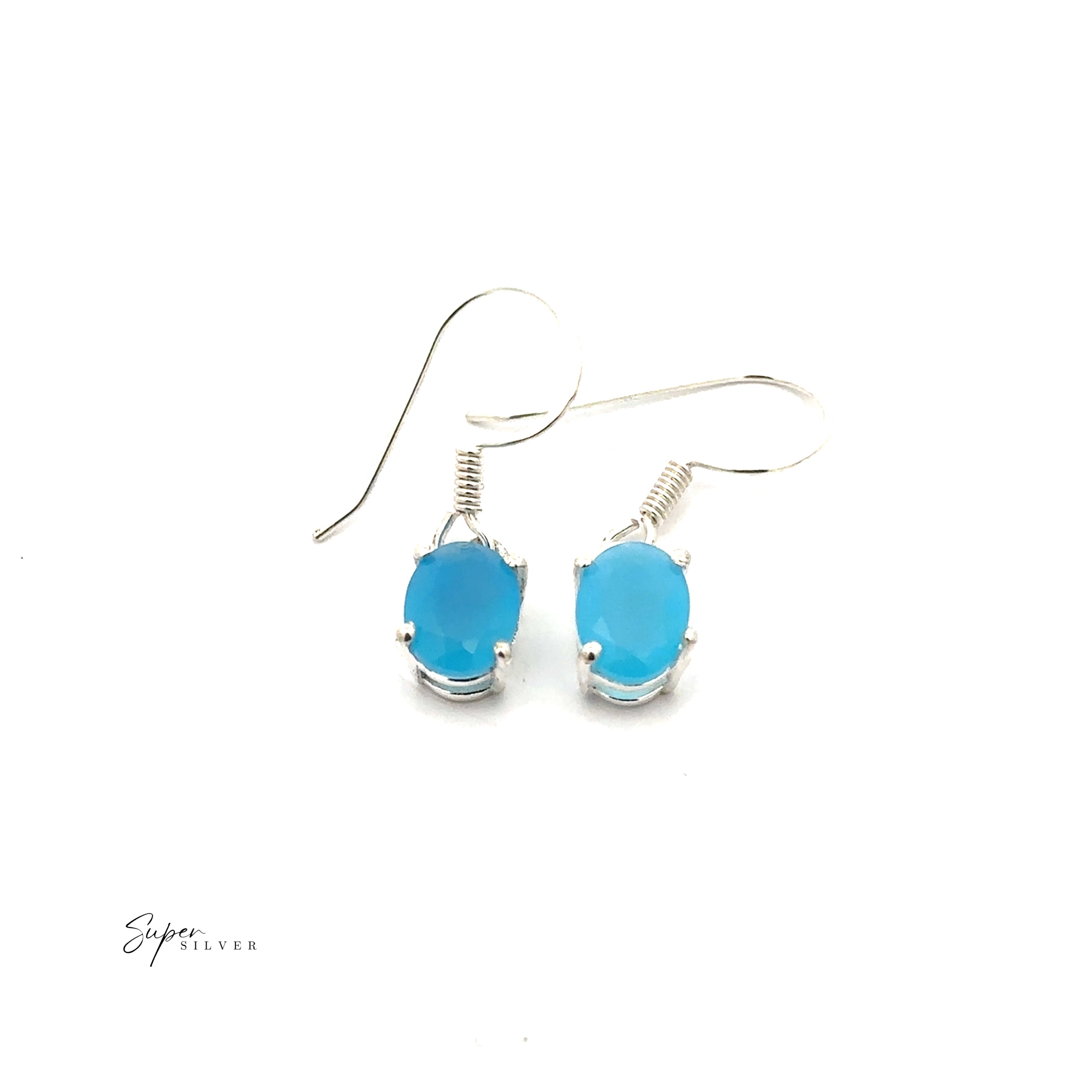The Brilliant Oval Gemstone Earrings feature oval-shaped blue stones set in prong settings on sterling silver, displayed against a white background.