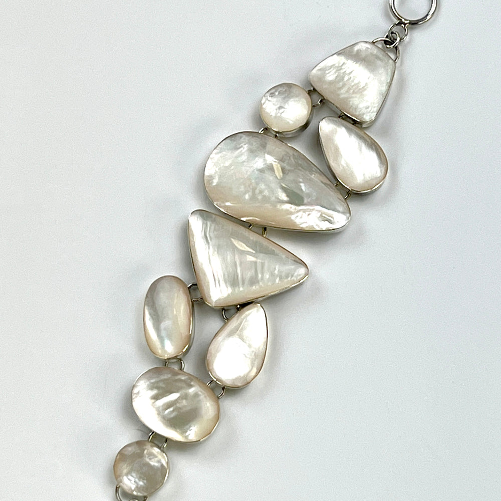 
                  
                    A Super Silver Statement Mother of Pearl Bracelet with a silver chain.
                  
                