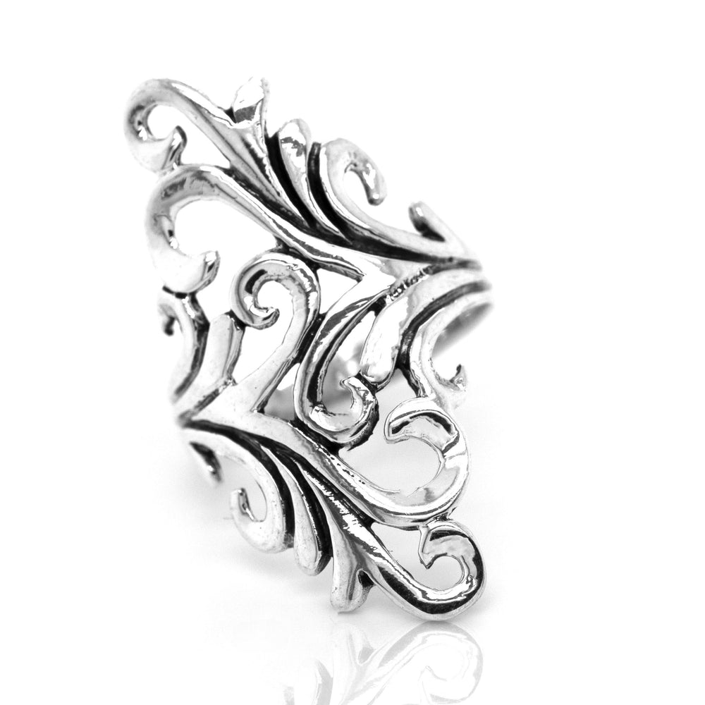 
                  
                    The Vintage Inspired Swirl Wrap Ring is crafted from sterling silver, showcasing intricate, swirling leaf-like designs that evoke the essence of Art Nouveau against a pristine white backdrop.
                  
                