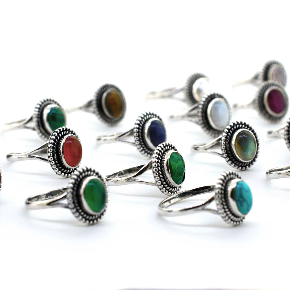 A boho-inspired collection of Gemstone Oval Shield Rings featuring stones in various vibrant hues.