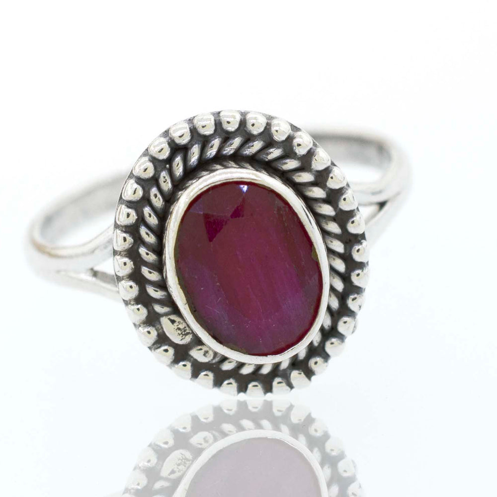 
                  
                    A boho silver Gemstone Oval Shield Ring with a cabochon ruby stone.
                  
                