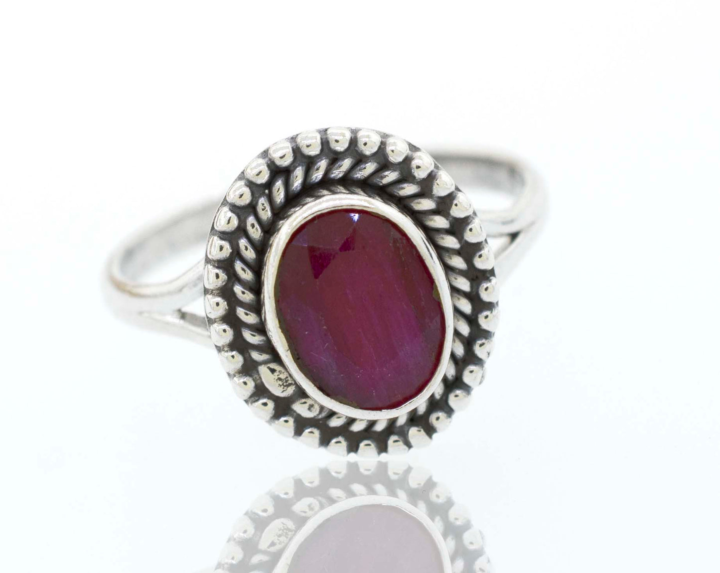 
                  
                    A boho silver Gemstone Oval Shield Ring with a cabochon ruby stone.
                  
                