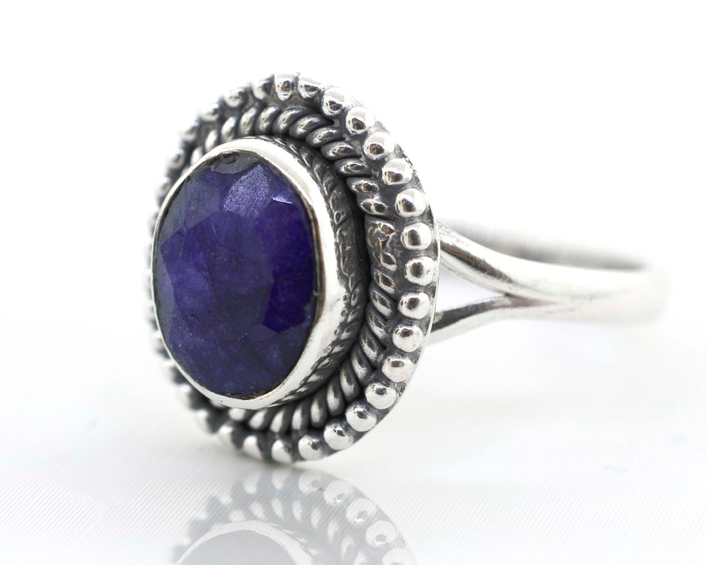 
                  
                    A boho Gemstone Oval Shield Ring with a purple stone.
                  
                