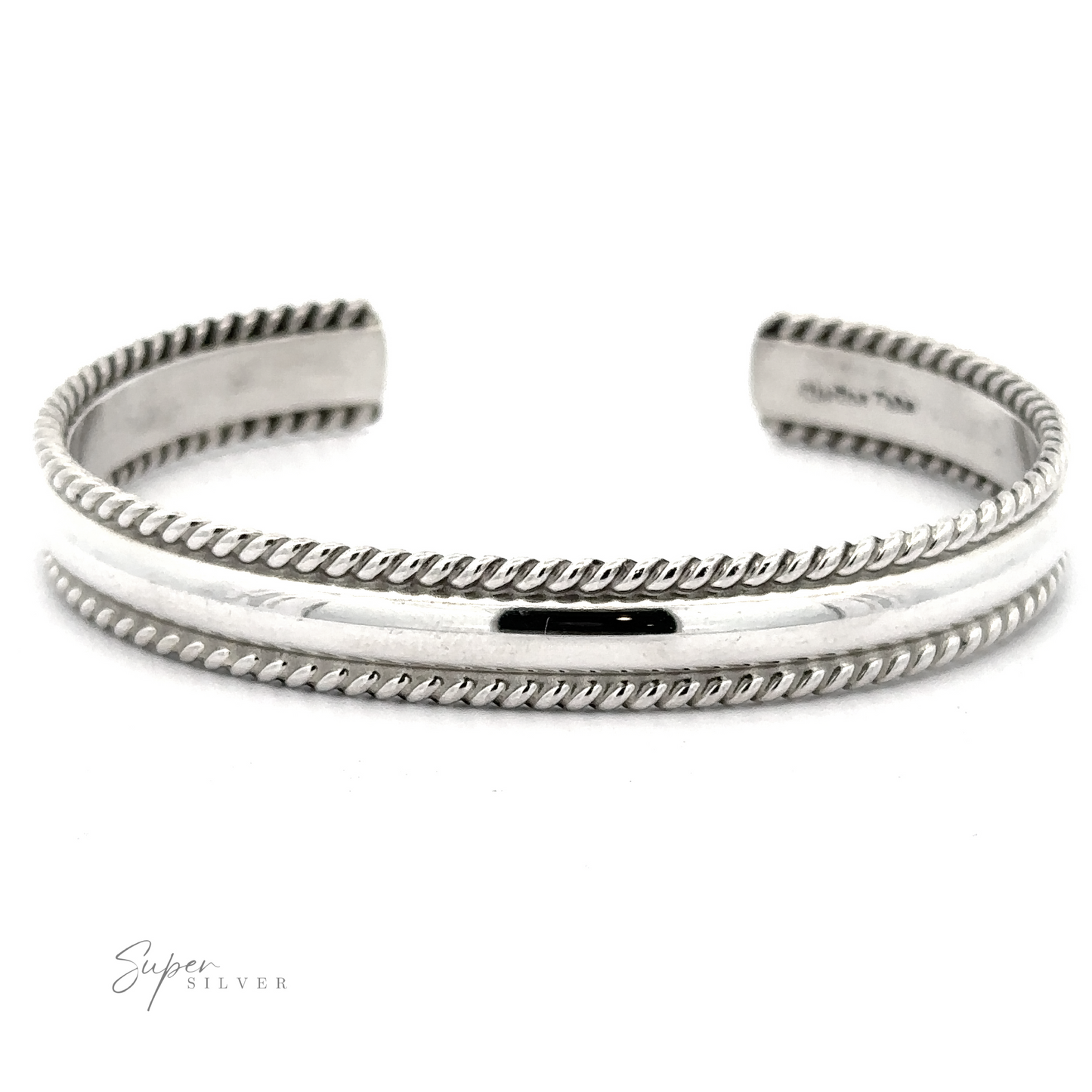 
                  
                    A Native American Handmade Silver Rope Cuff featuring a smooth central band flanked by rope-like detailing, perfect as a statement piece. The "Super Silver" logo is in the bottom-left corner.
                  
                