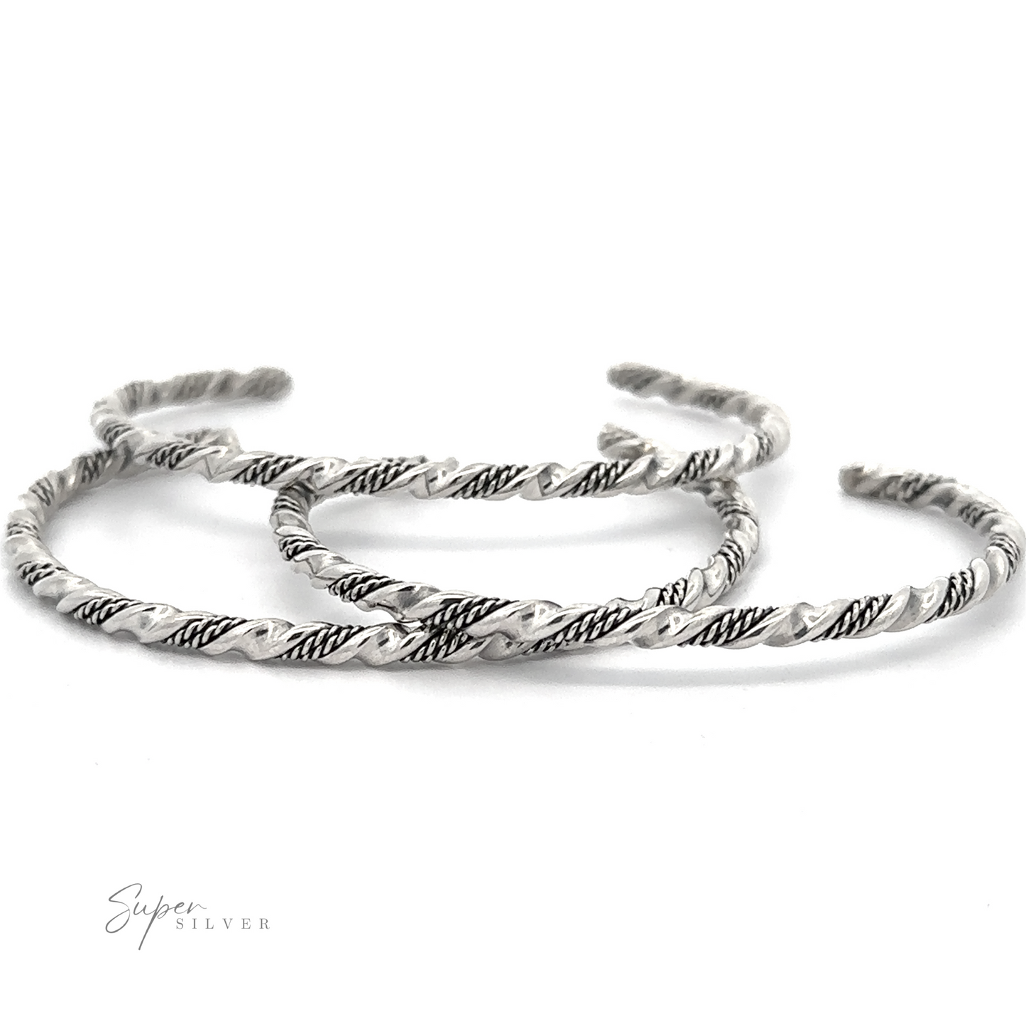 
                  
                    Three twisted, handmade Native American Handmade Silver Rope Twist Cuff bangles with intricate patterns are arranged on a white background. The brand "Super Silver" is labeled in the bottom left corner, showcasing their Native American-inspired design.
                  
                