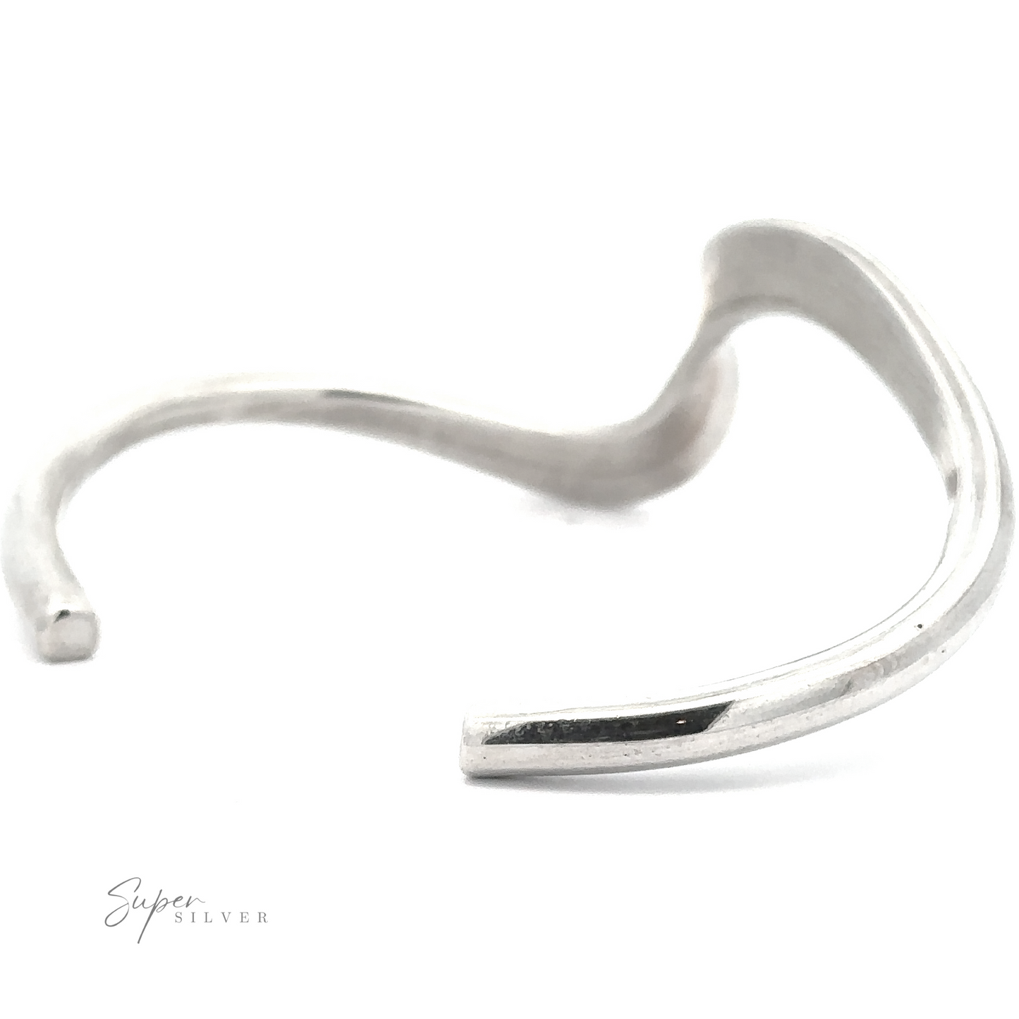 
                  
                    A minimalist, Native American Handmade Thick Silver Wave Cuff with fluid, curved lines.
                  
                