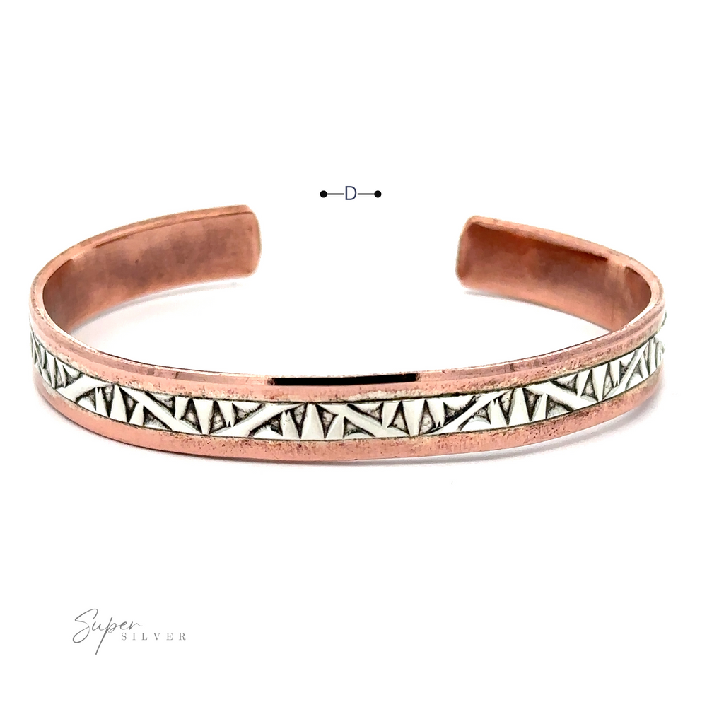 
                  
                    A Native American Handmade Copper And Silver Bracelet with an engraved white and black geometric pattern, featuring a small "Super Silver" logo in the corner. This exquisite piece is reminiscent of a Native American Cuff Bracelet, blending artistry and heritage seamlessly.
                  
                